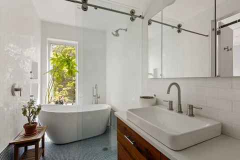 a room with a sink and a window
