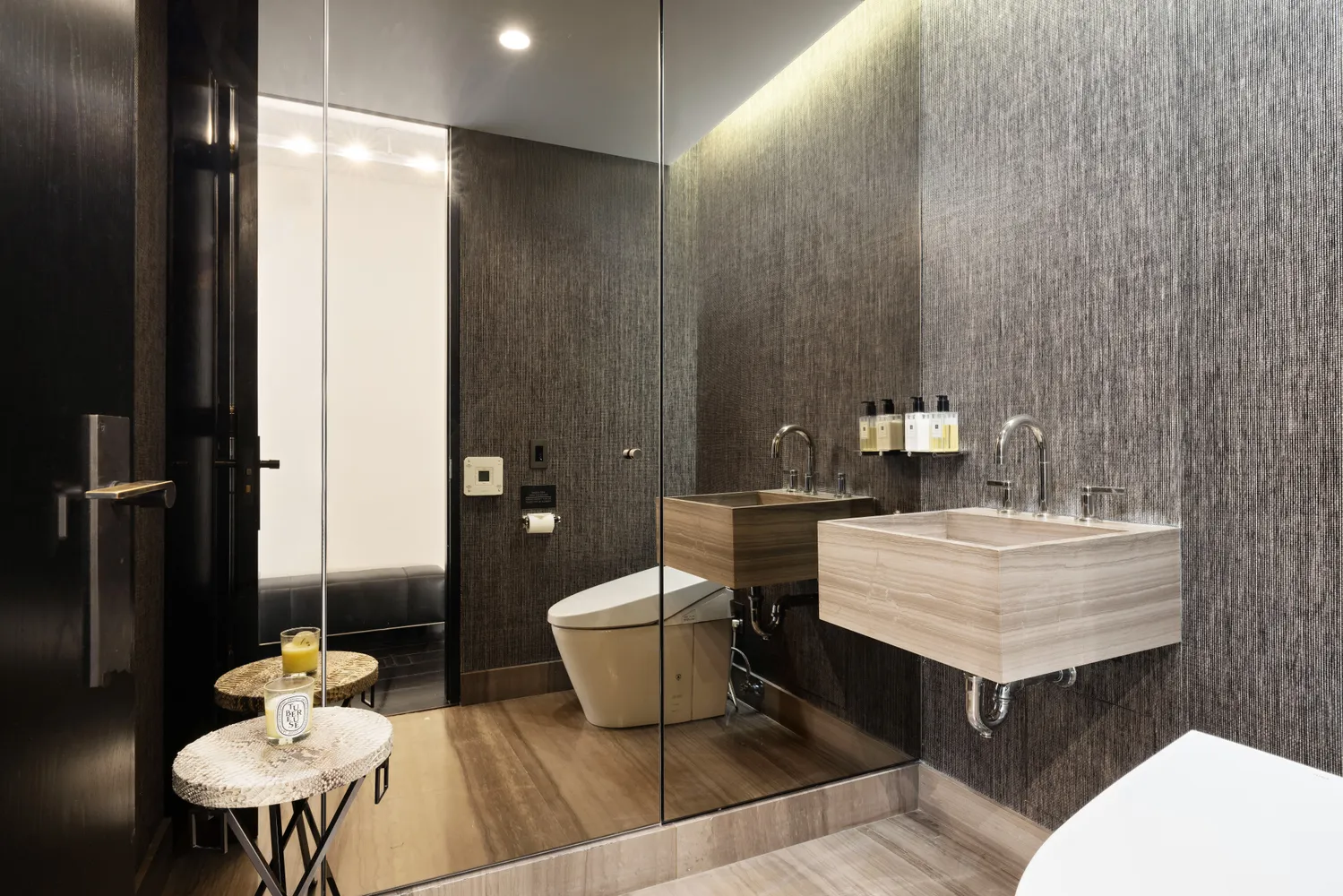 a bathroom with a sink toilet and a mirror