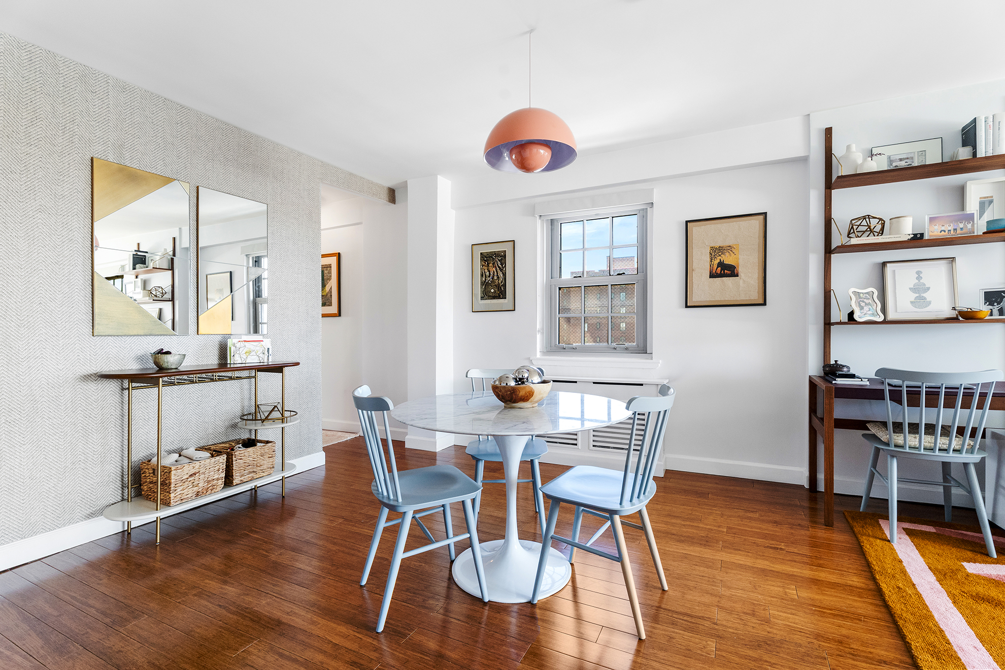 333 East 14th Street, Unit 10D Manhattan, NY 10003 - Photo 2 of 8 a view of a dining room with furniture and wooden floor