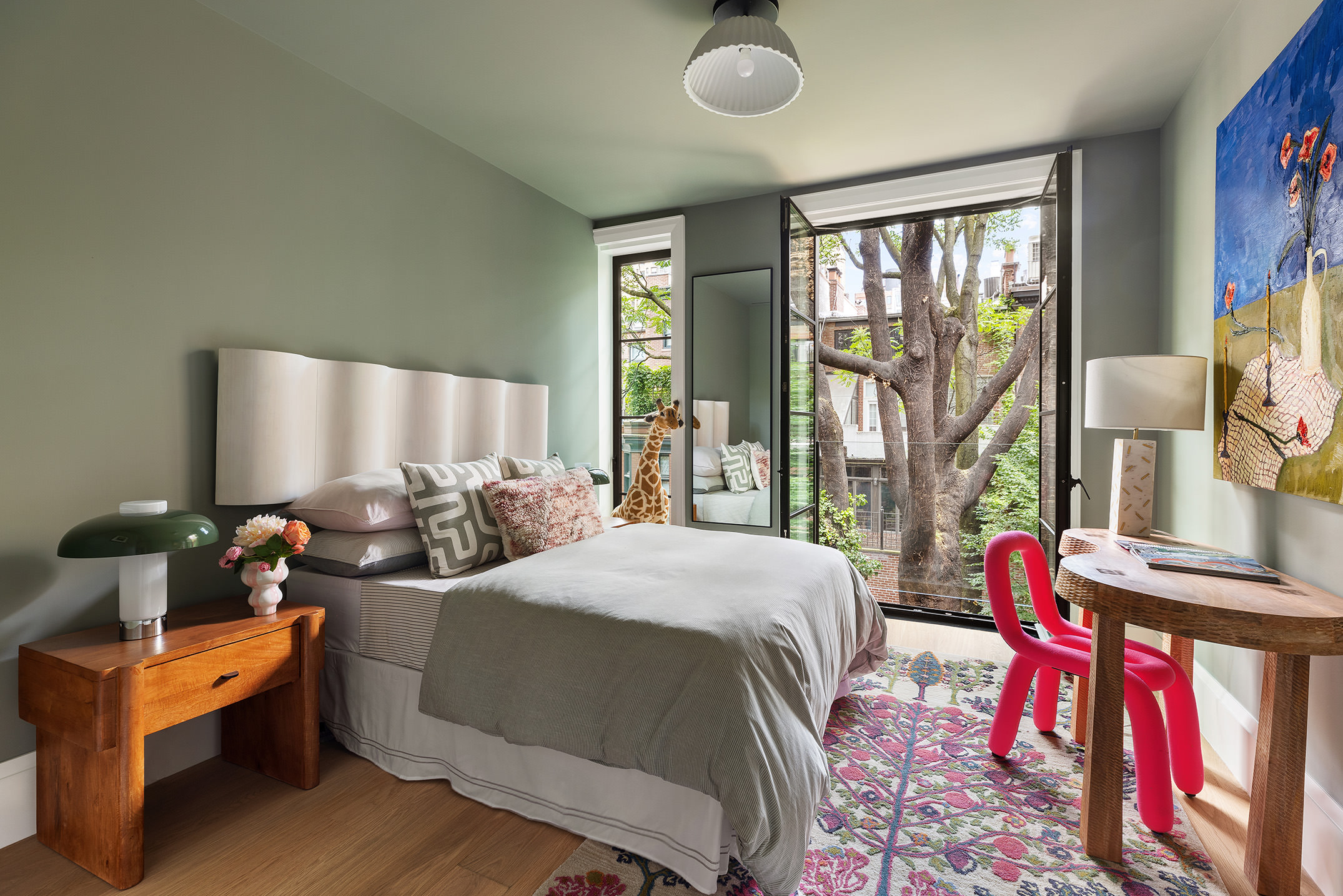 17 East 9th Street Manhattan, NY 10003 - Photo 18 of 32 a bedroom with furniture and a large window
