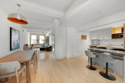 a workspace with furniture and wooden floor