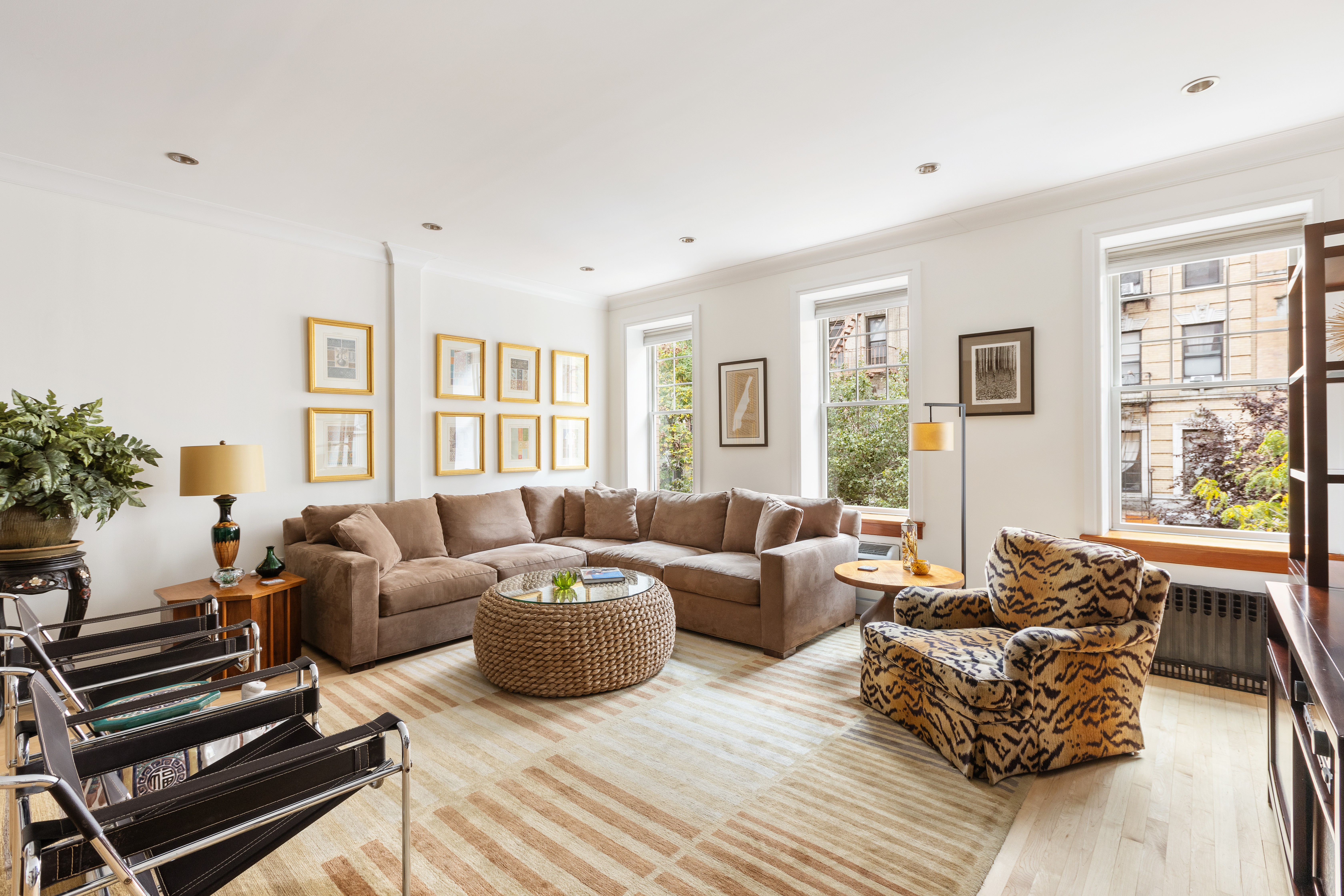 203 East 7th Street, Unit 2 Manhattan, NY 10009 - Photo 2 of 9 a living room with furniture and a window