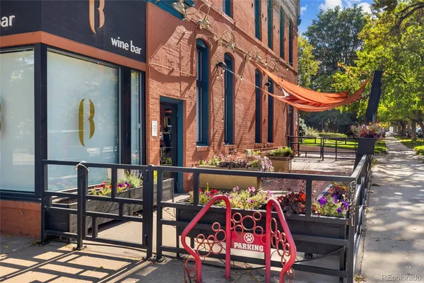 a view of a street with stores