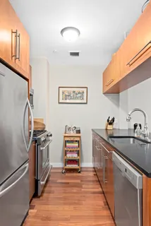 a kitchen with stainless steel appliances granite countertop a stove and a sink
