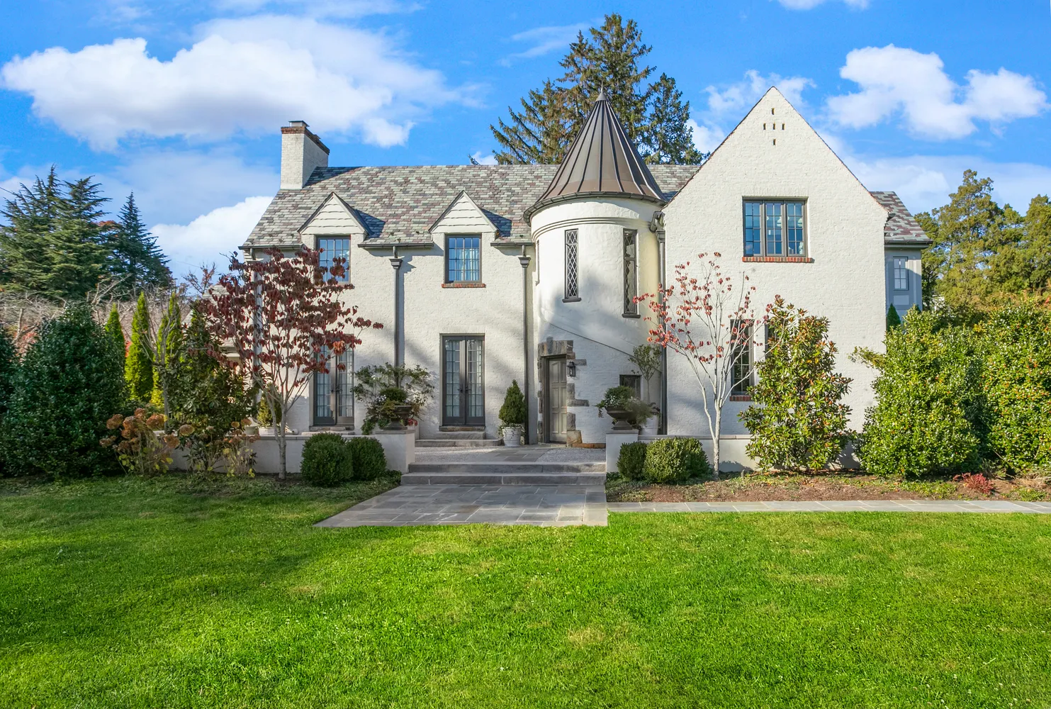 a front view of a house with a yard