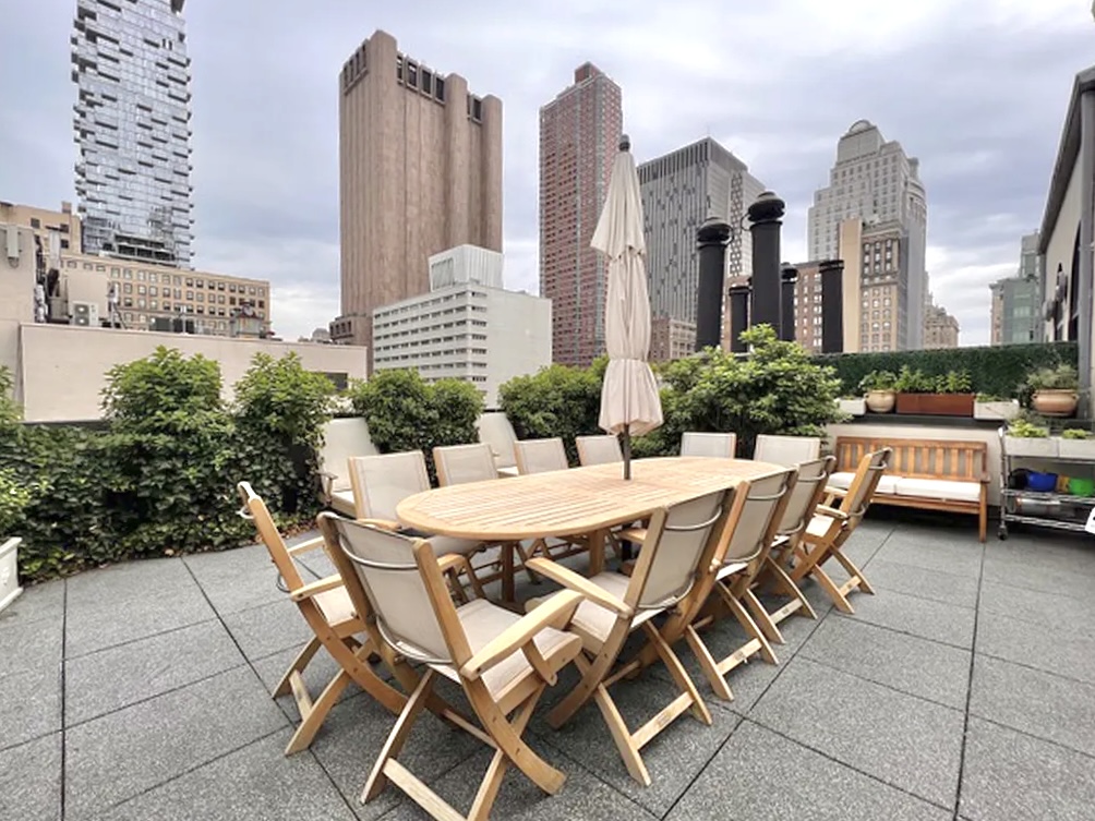99 Reade Street, Unit 4E Manhattan, NY 10013 - Photo 9 of 11 a view of a patio with table and chairs and potted plants