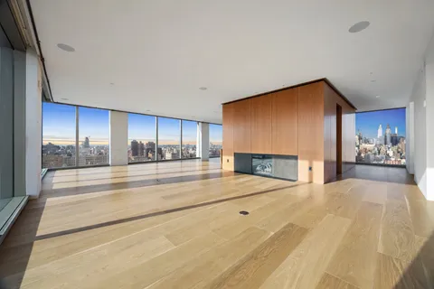 a view of a kitchen with a sink and a fireplace