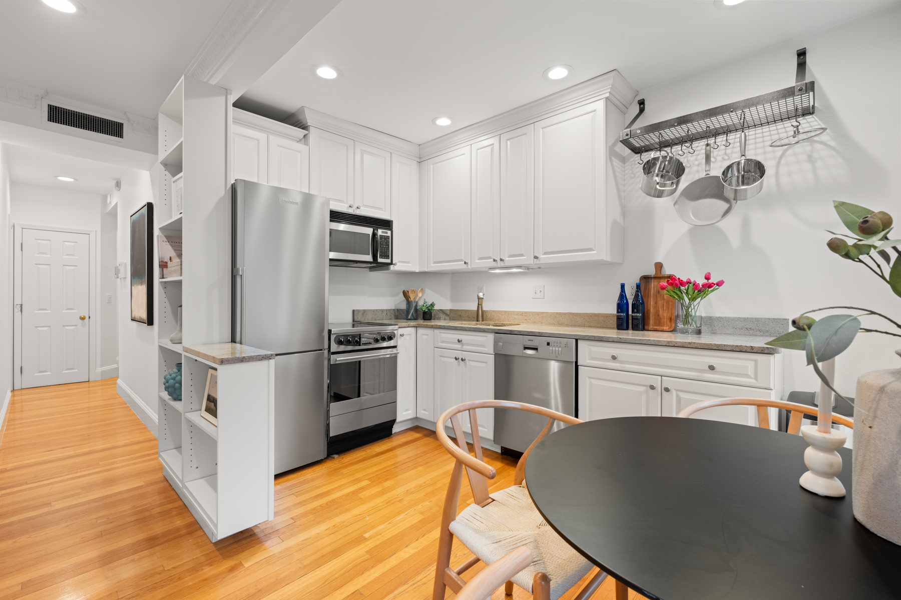 63 West Cedar Street, Unit 3 Boston, MA 02114 - Photo 7 of 17 a kitchen with stainless steel appliances a refrigerator sink and cabinets