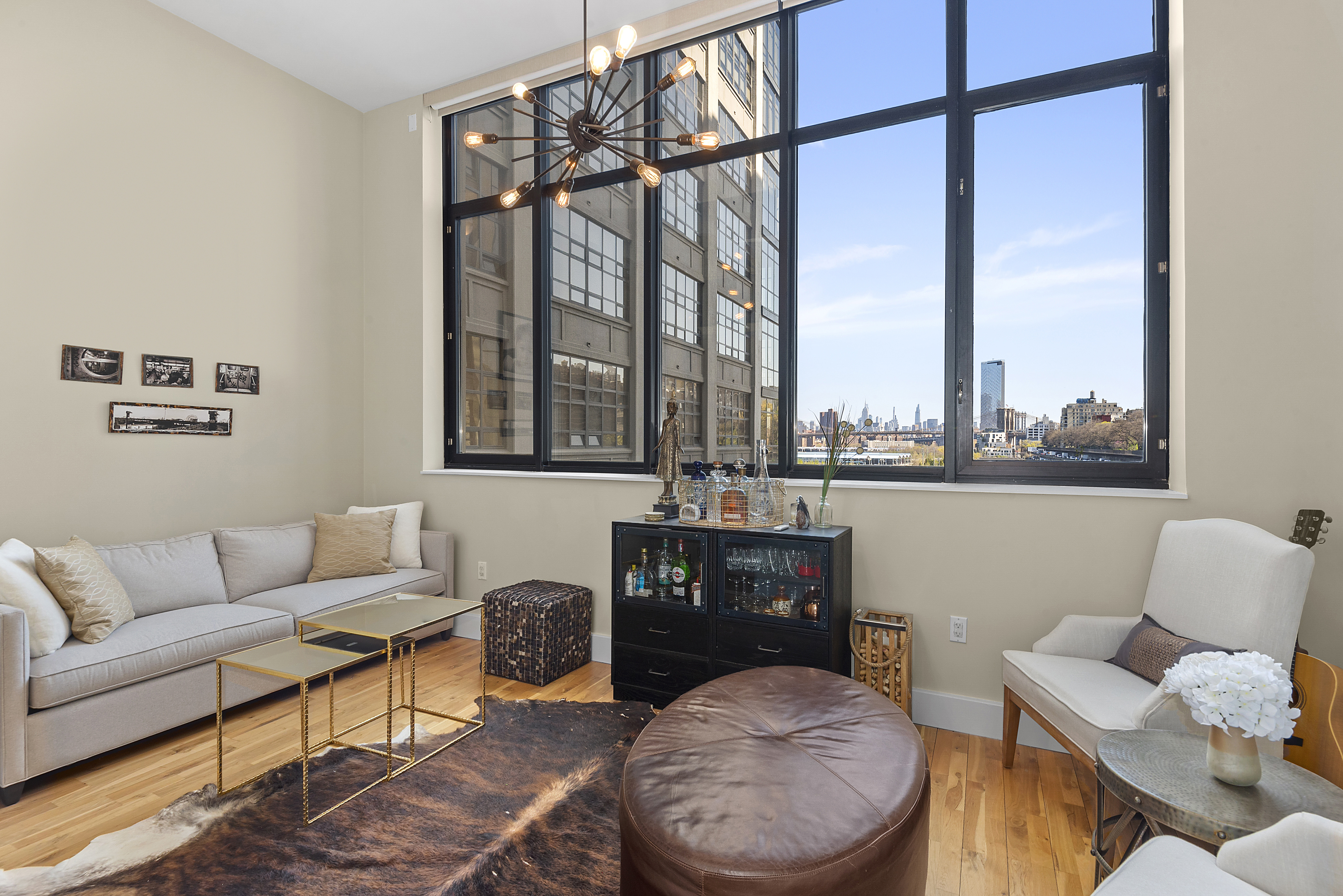 360 Furman Street, Unit 723/724 Brooklyn, NY 11201 - Photo 17 of 63 a living room with furniture and a floor to ceiling window