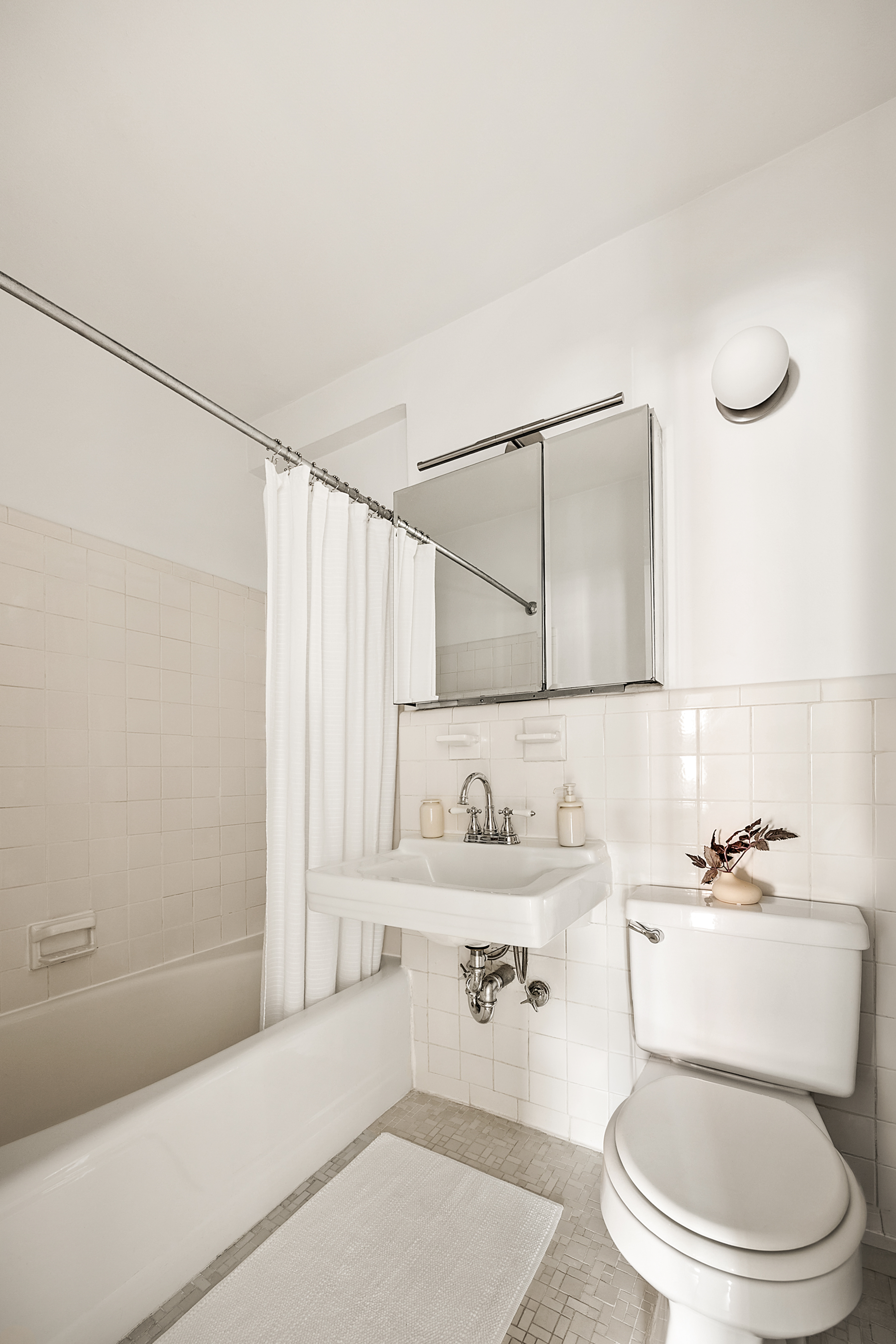 15 Charles Street, Unit 2H Manhattan, NY 10014 - Photo 8 of 12 a bathroom with a sink toilet and shower