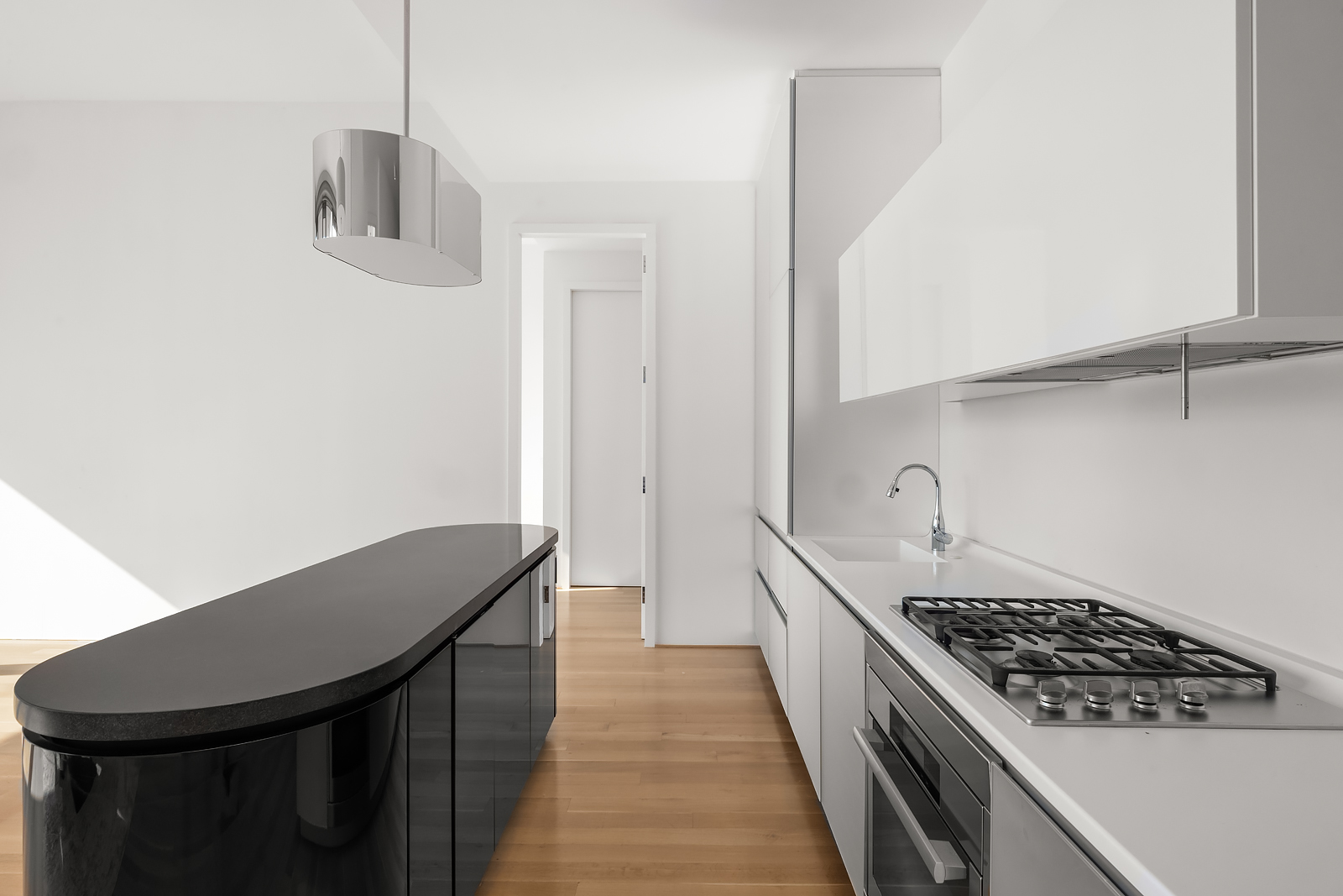 56 Leonard Street, Unit 39BEAST Manhattan, NY 10013 - Photo 5 of 18 a kitchen with stainless steel appliances granite countertop a stove a sink and a refrigerator