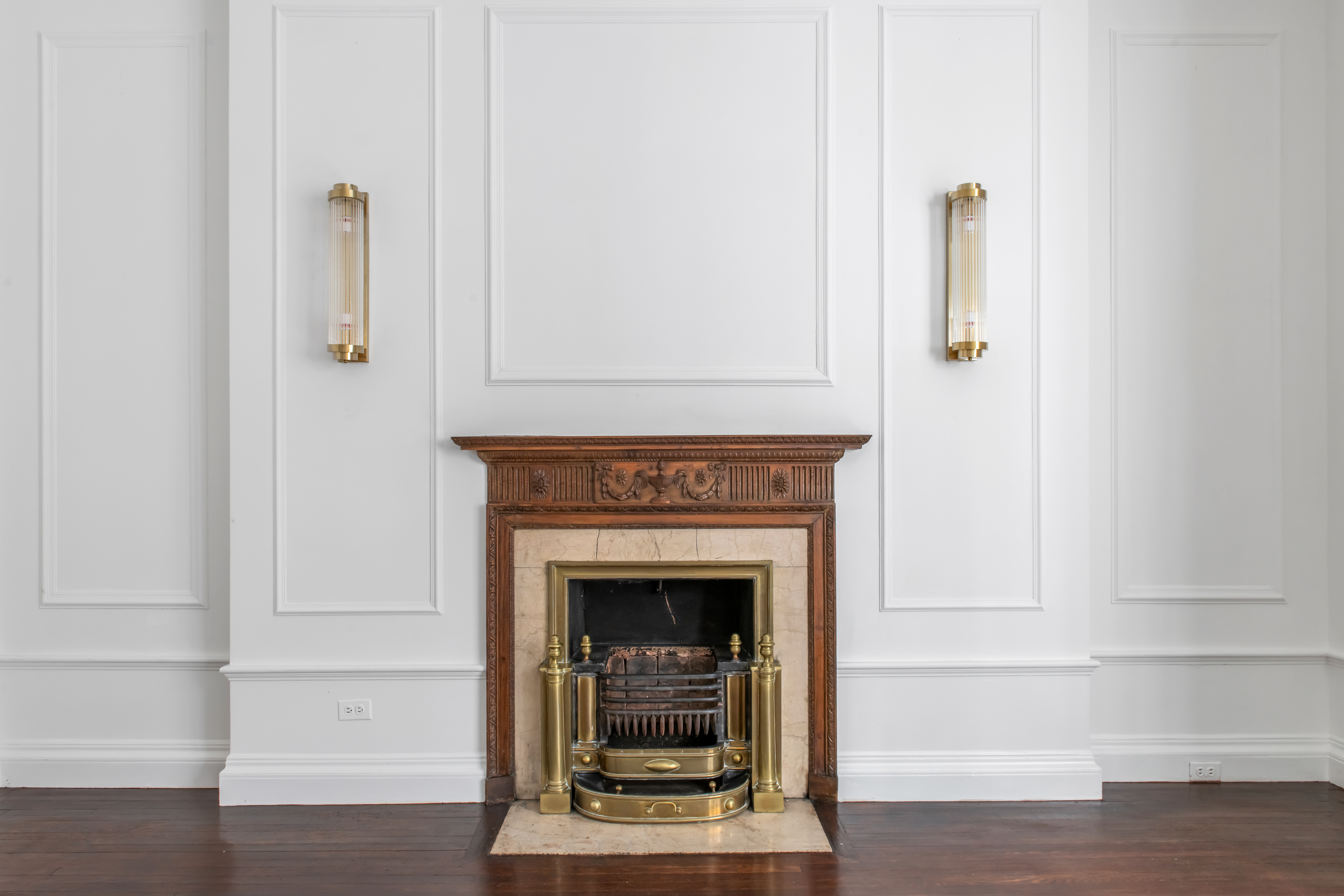 155 East 70th Street Manhattan, NY 10021 - Photo 23 of 27 a view of a livingroom with wooden floor and a fireplace