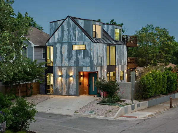 a front view of a house with a swimming pool