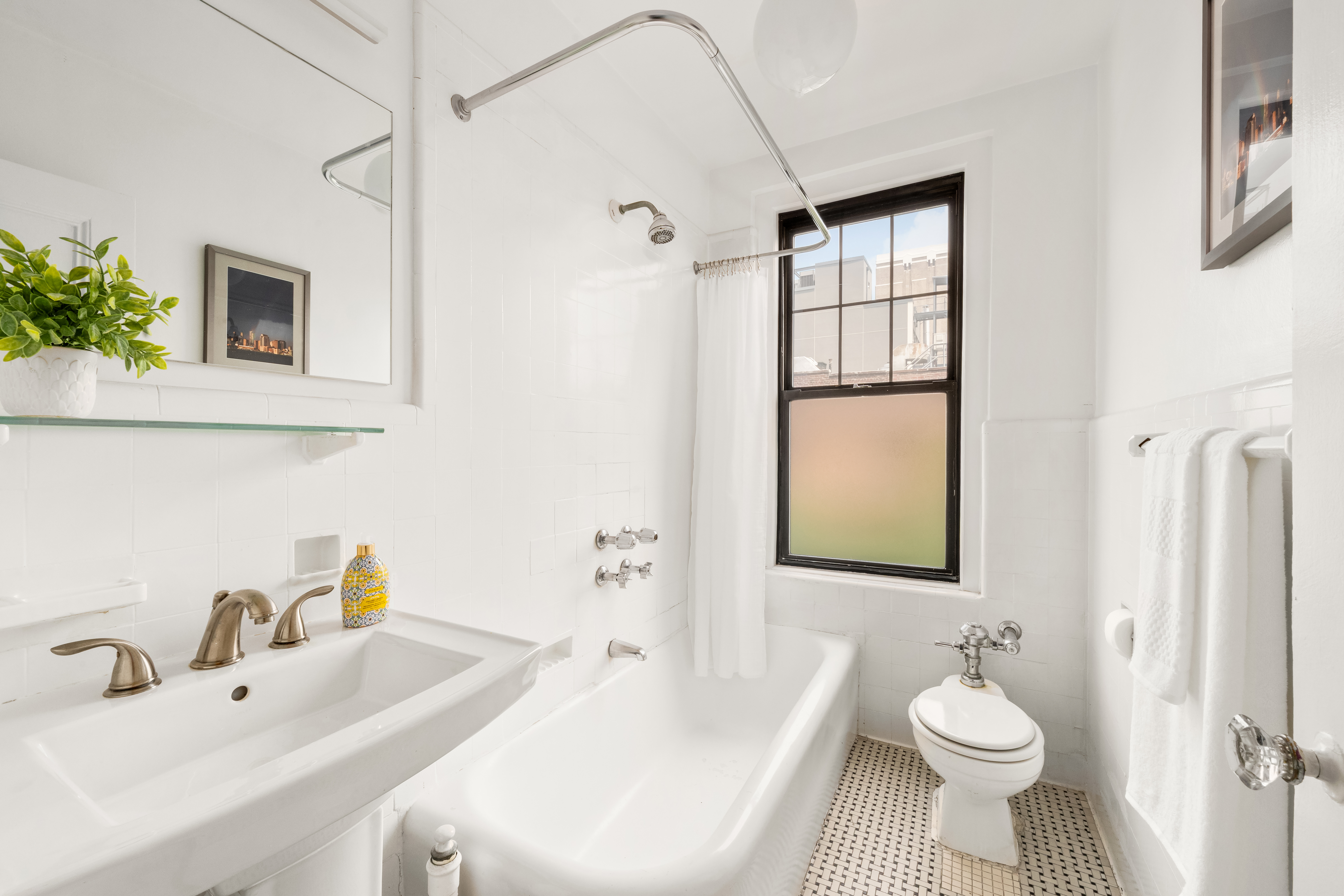 170 2nd Avenue, Unit 5C Manhattan, NY 10003 - Photo 4 of 8 a bathroom with a sink toilet and shower