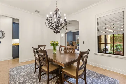 a view of a dining room with furniture and window