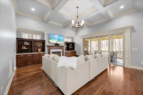 a kitchen with stainless steel appliances granite countertop a sink a stove and a wooden floors