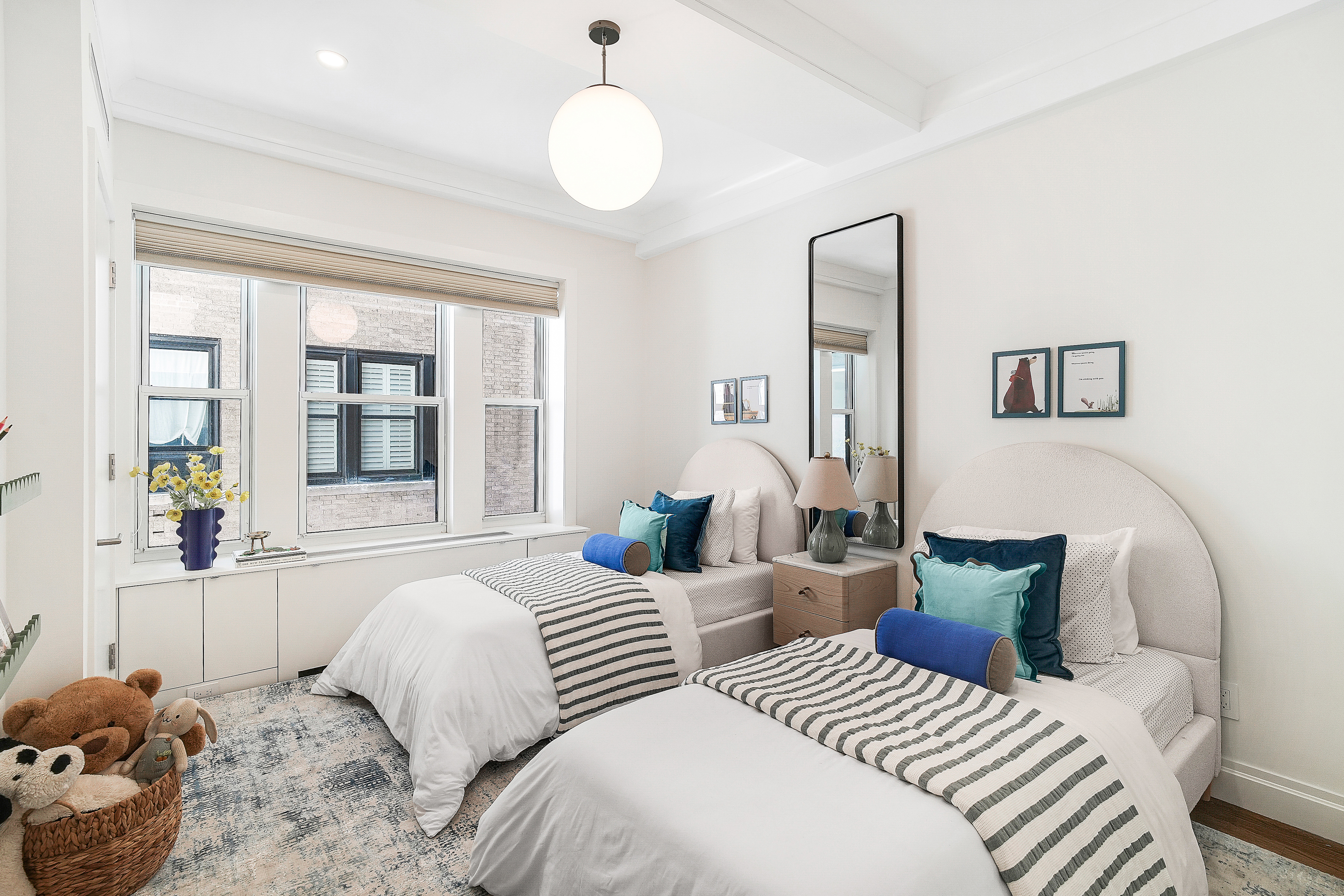 215 West 88th Street, Unit 3E Manhattan, NY 10024 - Photo 6 of 16 a bedroom with two beds and a large window