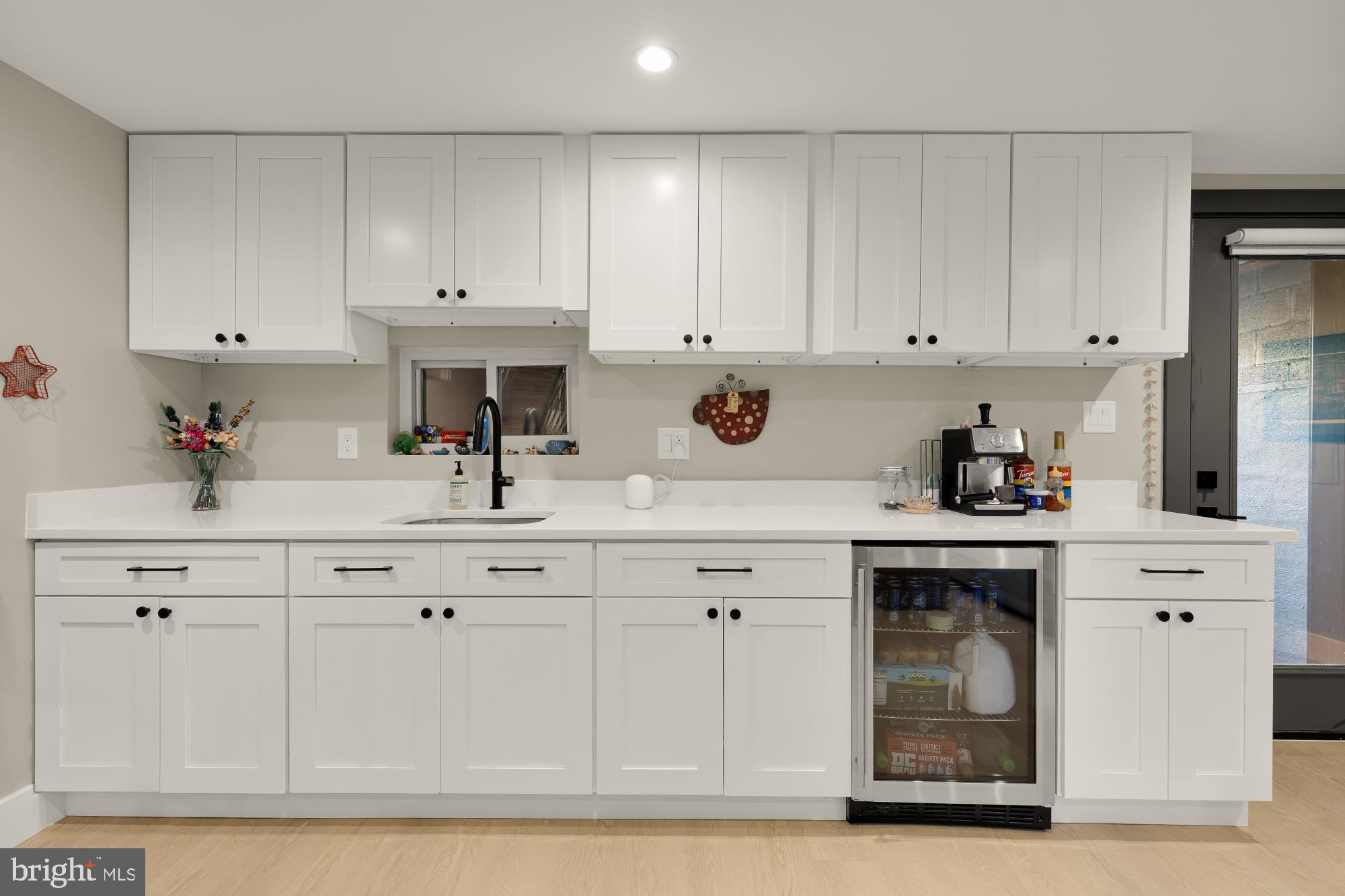 47 T Street Northeast Washington, DC 20002 - Photo 38 of 45 a kitchen with white cabinets and sink