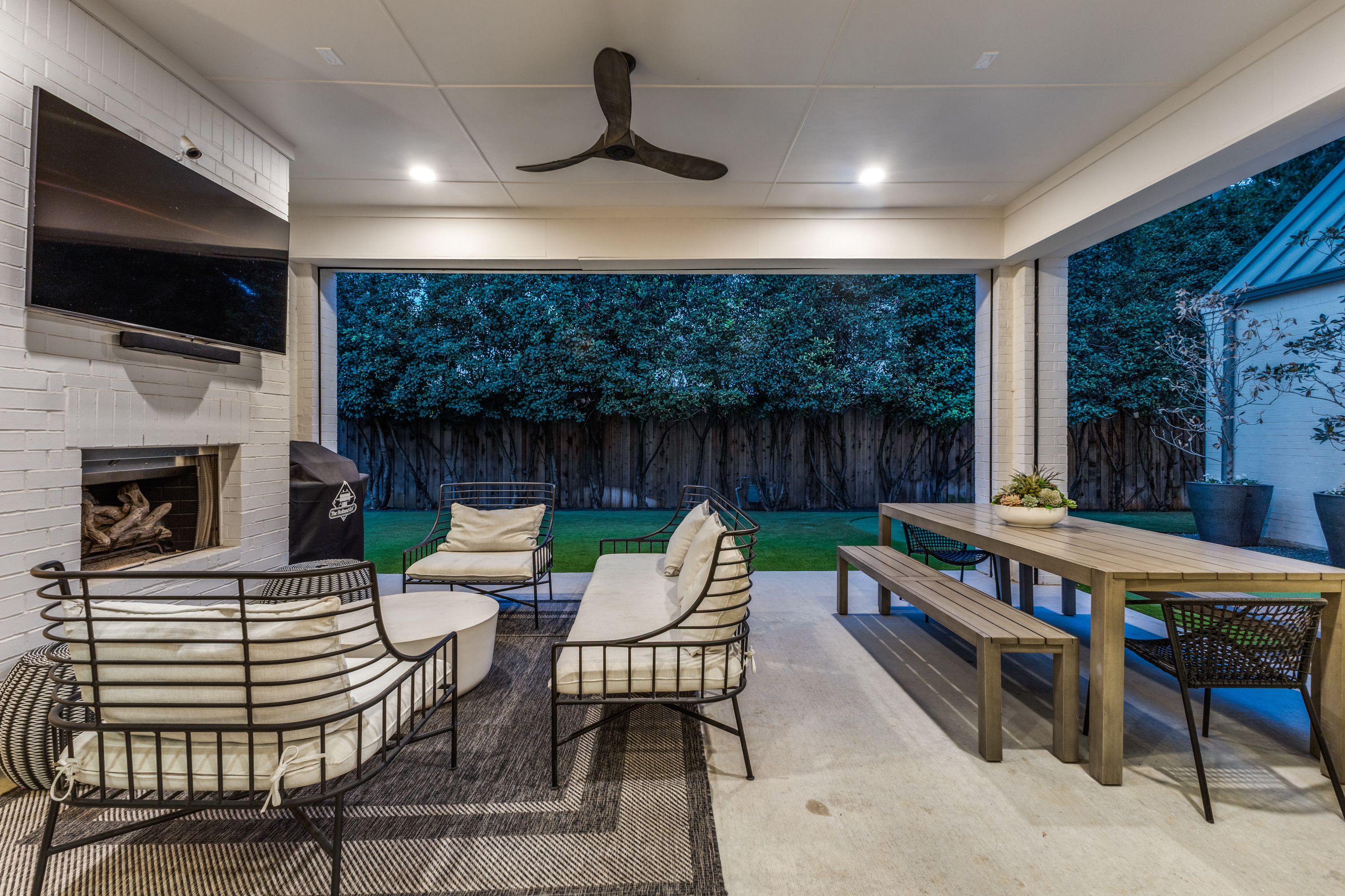 4042 Dunhaven Road Dallas, TX 75220 - Photo 32 of 34 a outdoor space with patio the couches and a flat screen tv