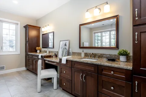 a kitchen with a sink stove and microwave
