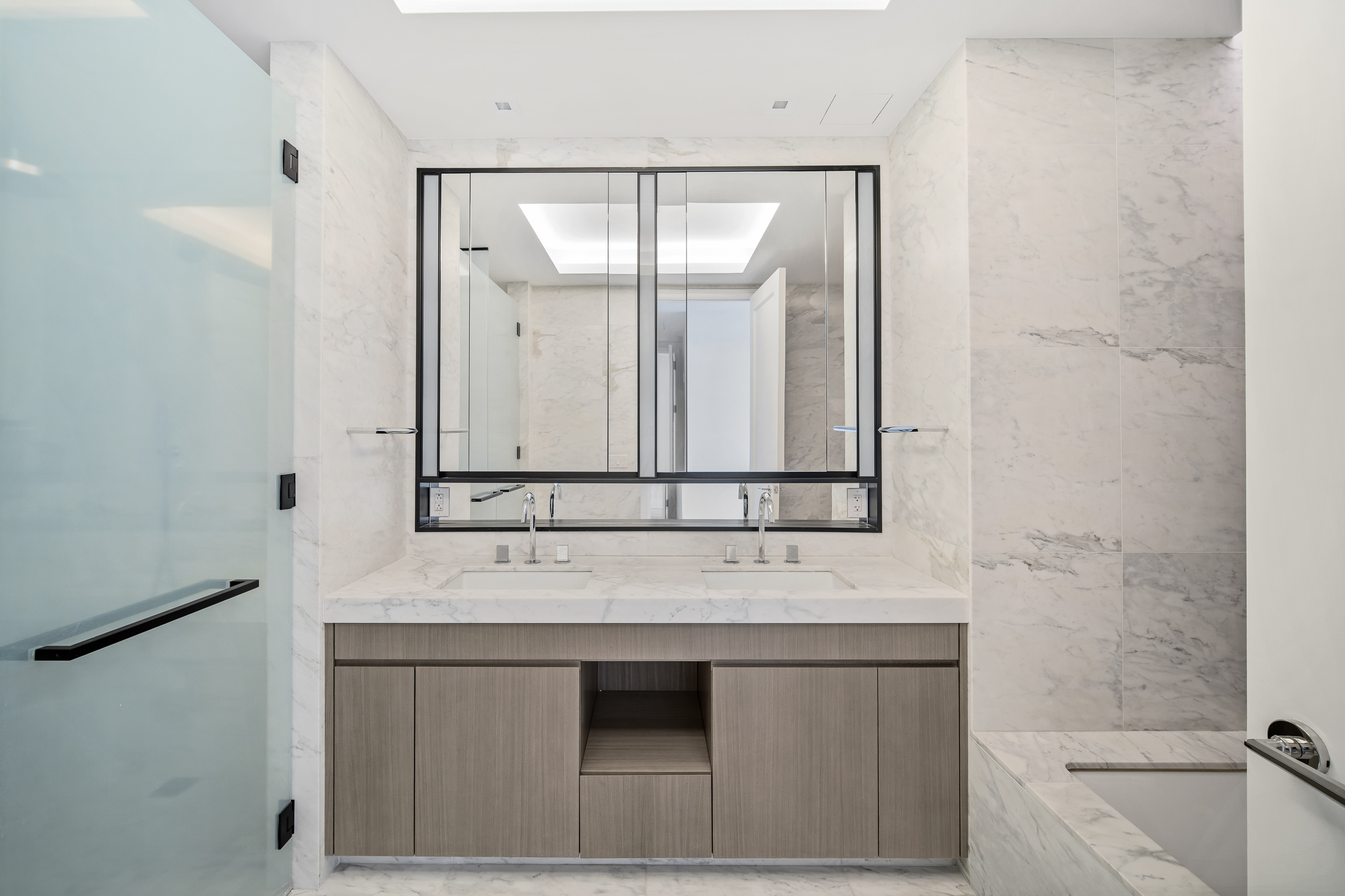 108 Leonard Street, Unit 12F Manhattan, NY 10013 - Photo 8 of 15 a bathroom with a sink and a mirror