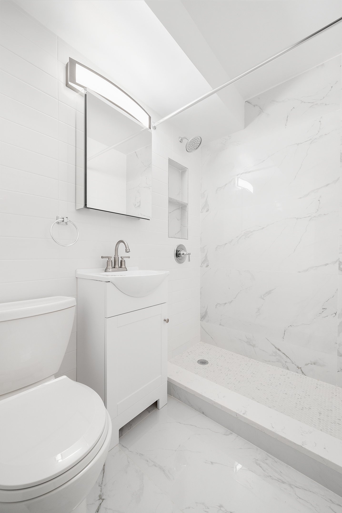 122 Ashland Place, Unit 12L Brooklyn, NY 11201 - Photo 9 of 16 a bathroom with a sink a toilet and shower
