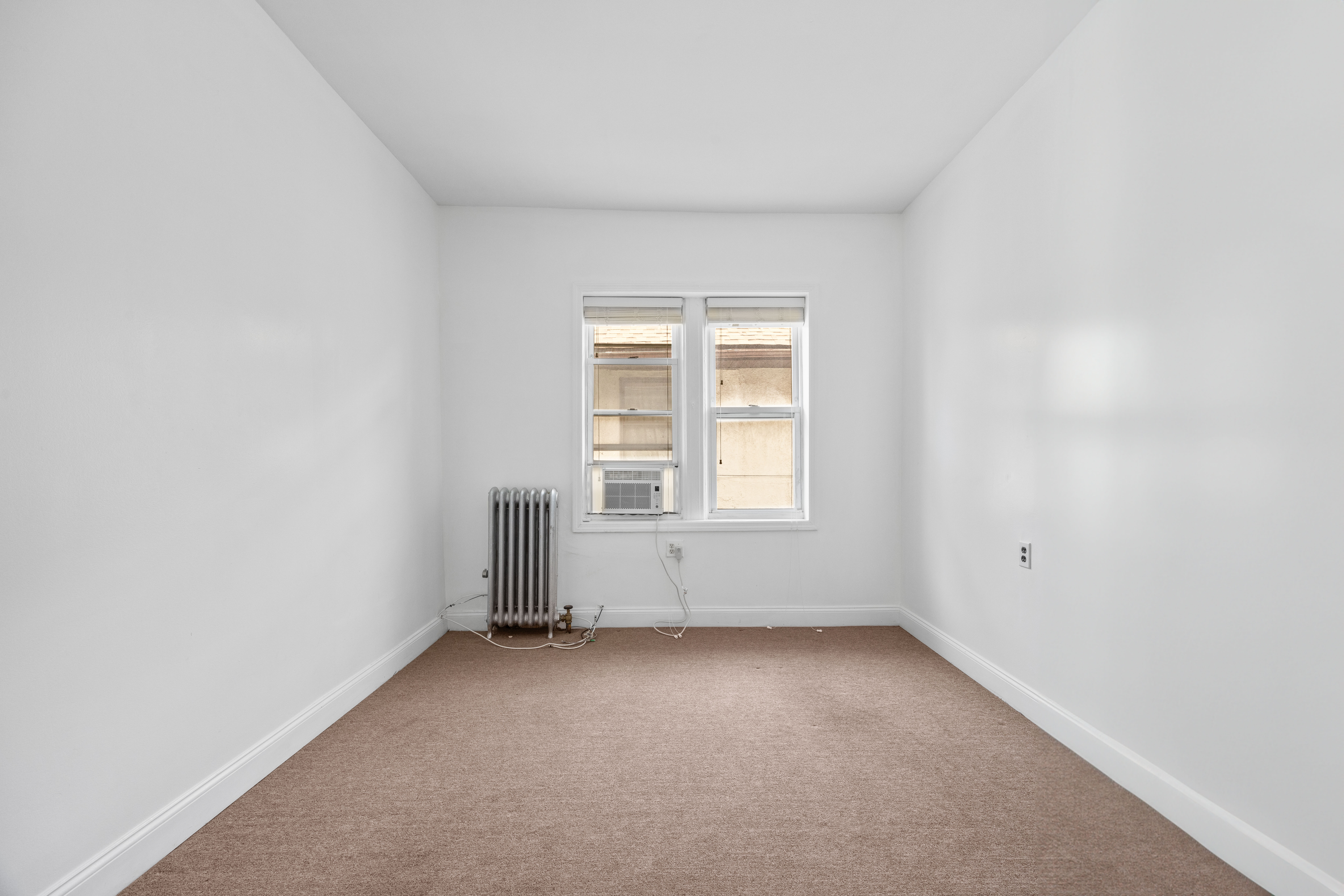 3712 Oceanic Avenue, Unit 2 Brooklyn, NY 11224 - Photo 13 of 14 an empty room with a window