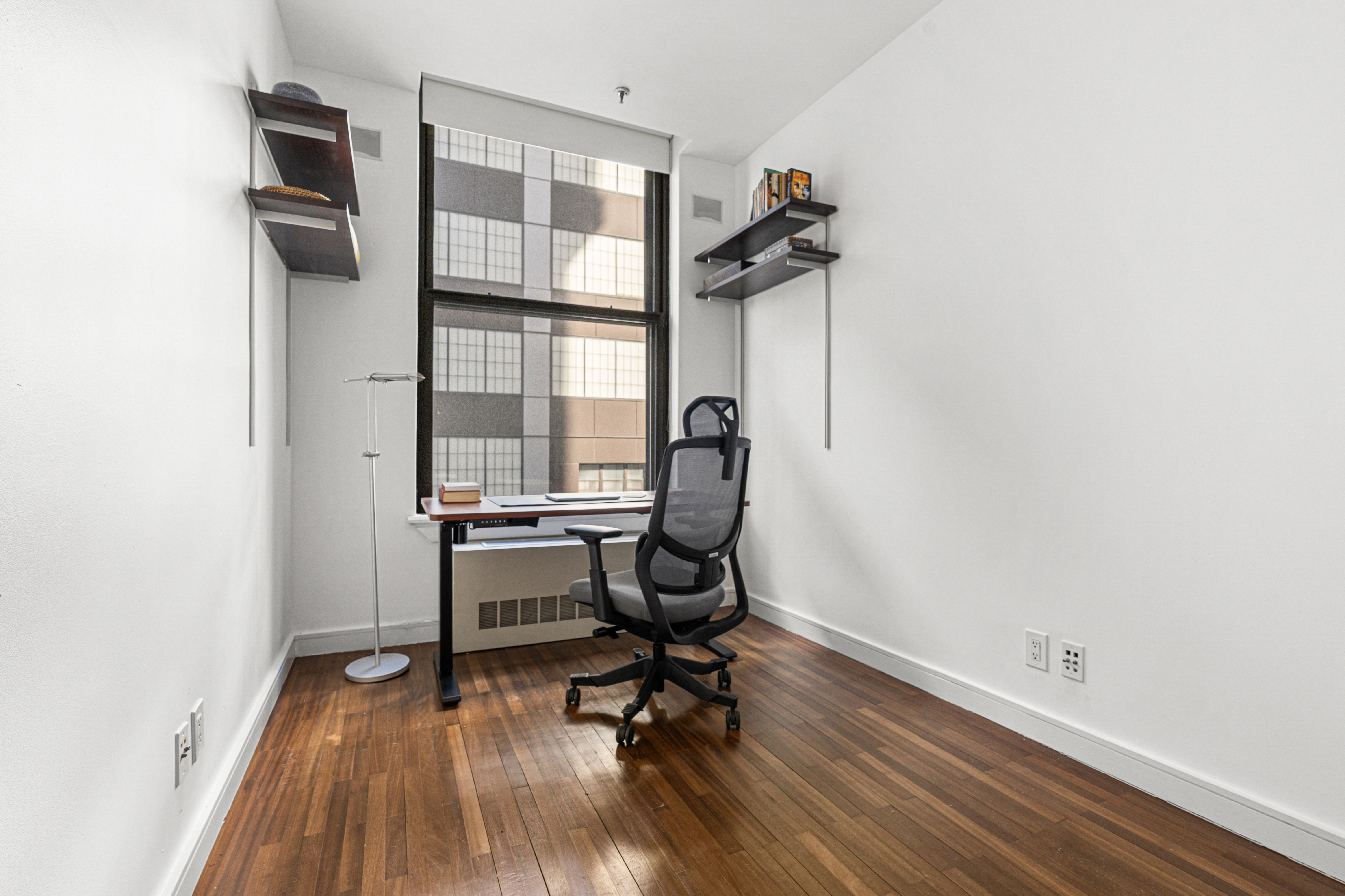 552 West 43rd Street, Unit 3A Manhattan, NY 10036 - Photo 7 of 11 a view of a room with gym equipment and a window