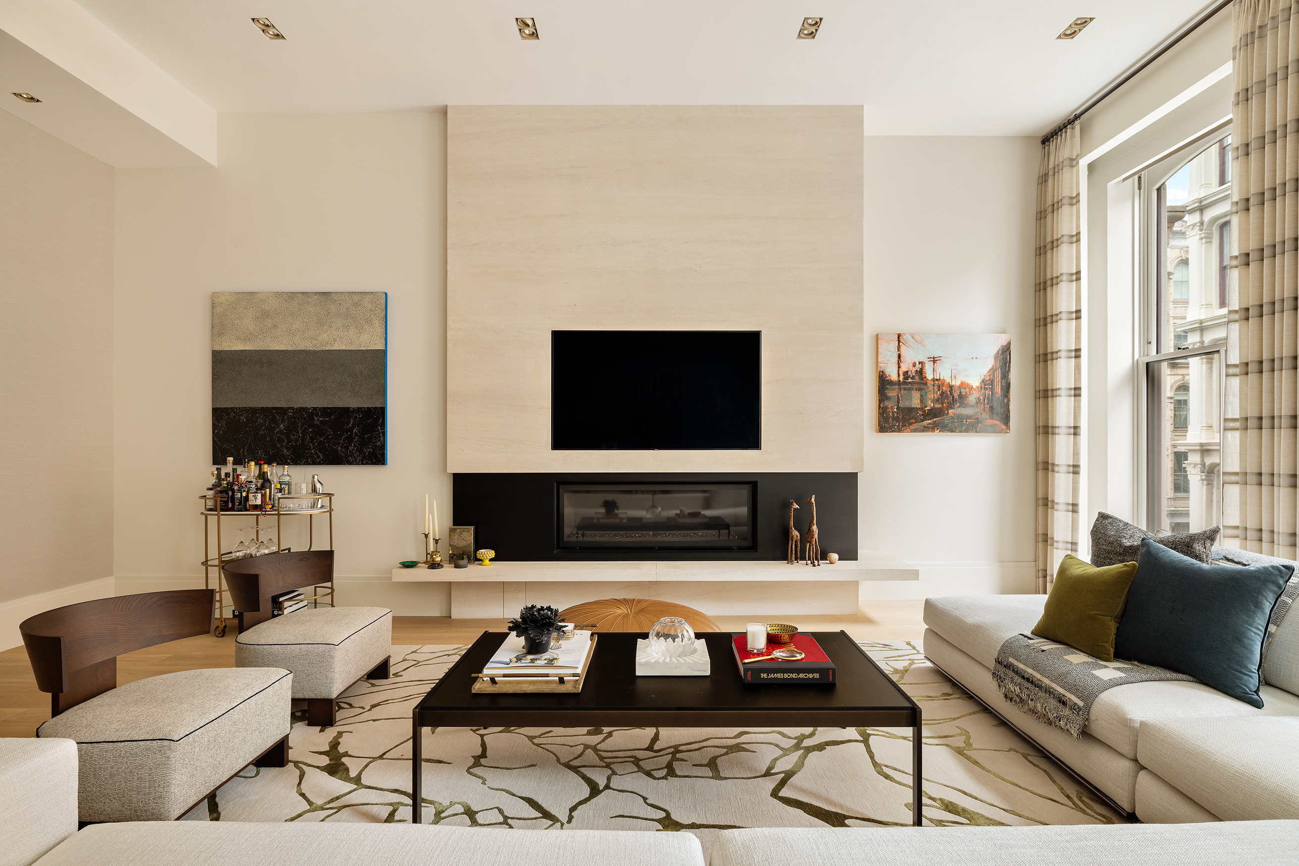 53 Greene Street, Unit 3 Manhattan, NY 10013 - Photo 5 of 22 a living room with furniture a flat screen tv and a window