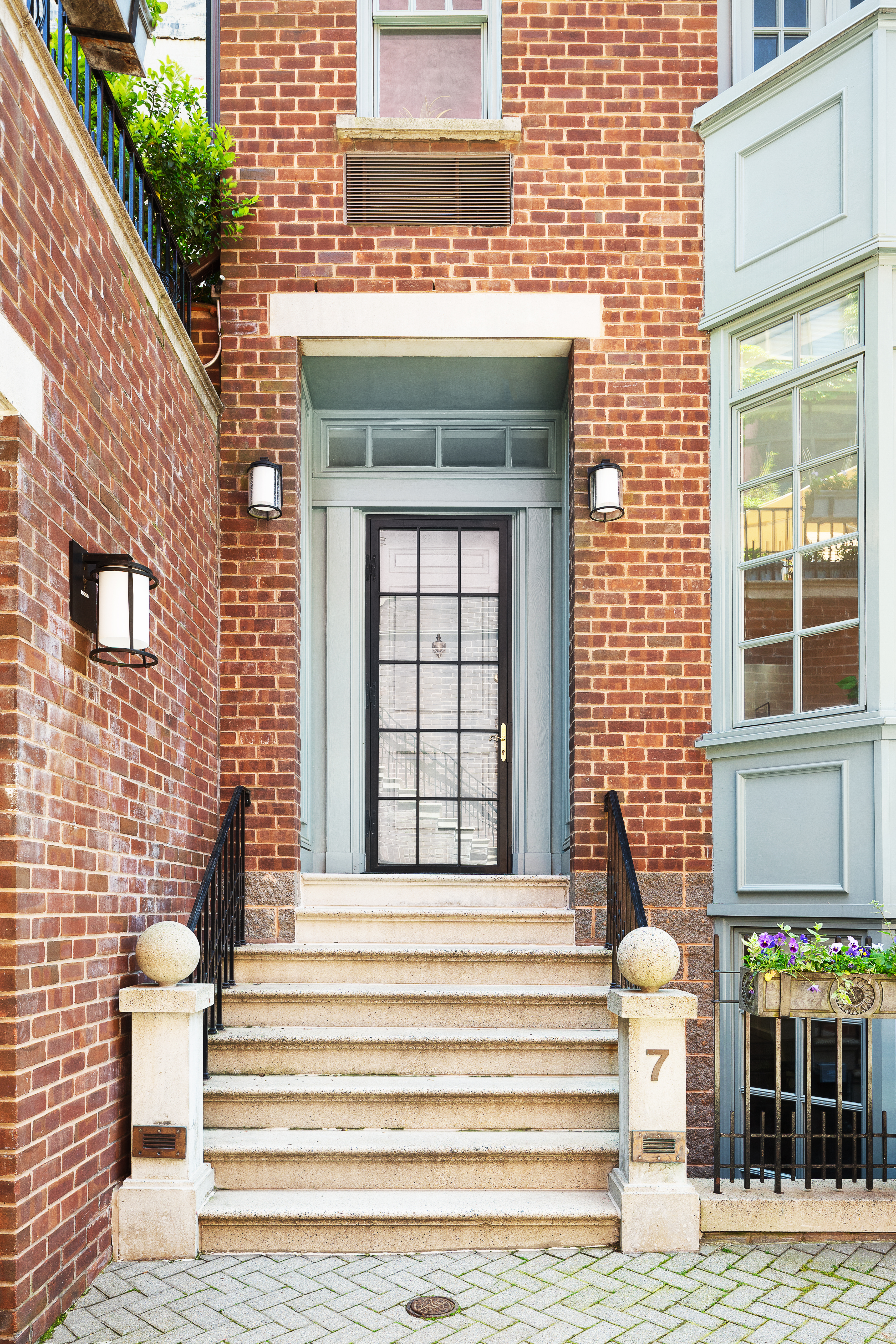 687 Greenwich Street, Unit TH7 Manhattan, NY 10014 - Photo 19 of 23 a front view of a house with a outdoor view and large windows