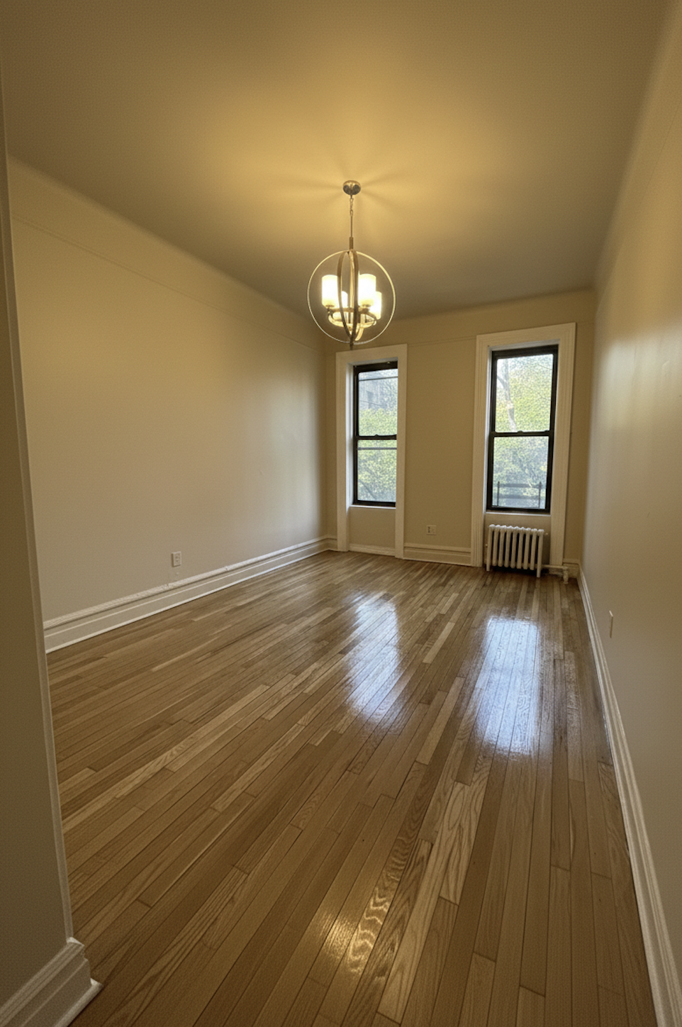 408 8th Avenue, Unit 1C Brooklyn, NY 11215 - Photo 6 of 13 a view of livingroom with hardwood floor and window