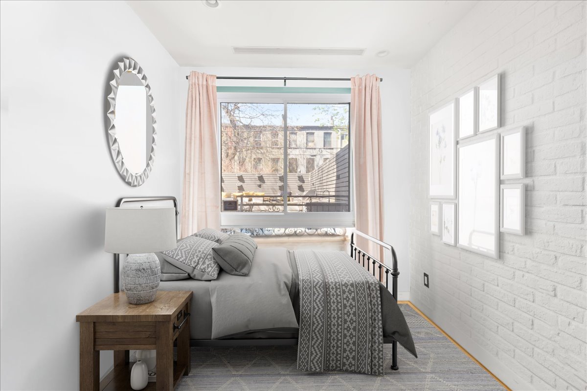 577 Madison Street, Unit 1B Brooklyn, NY 11221 - Photo 4 of 15 a living room with furniture and a window