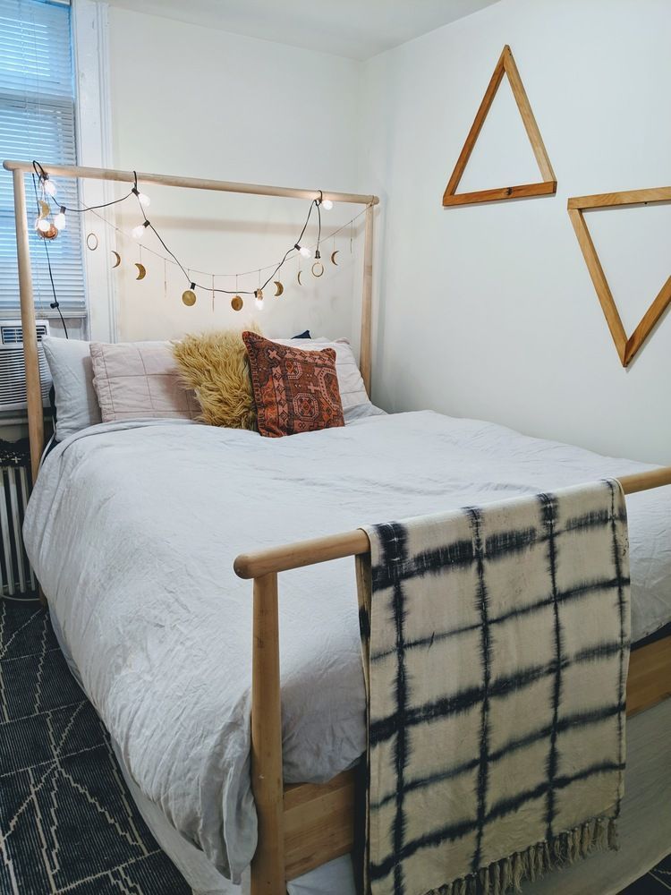 283 Devoe Street, Unit 2RR Brooklyn, NY 11211 - Photo 5 of 11 a bedroom with a bed and a painting on the wall