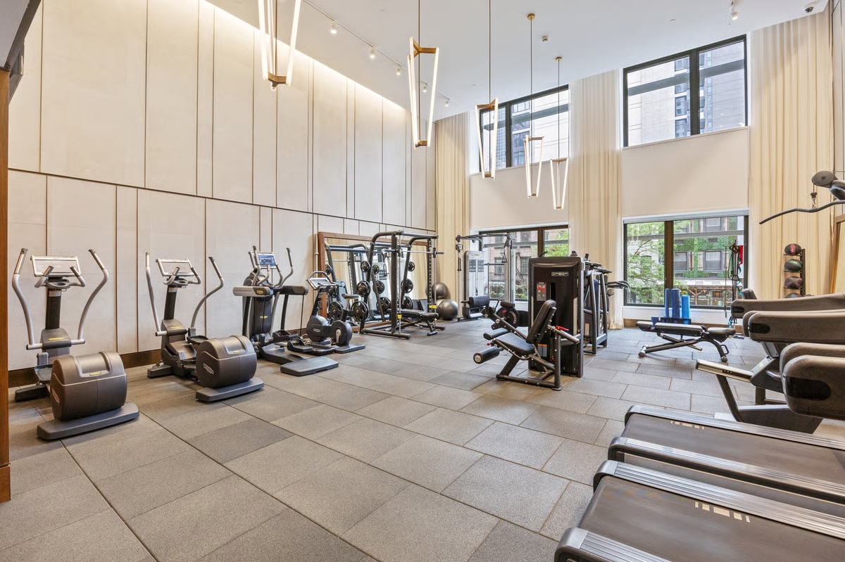 301 East 50th Street, Unit 5A Manhattan, NY 10022 - Photo 16 of 19 a view of a room with gym equipment