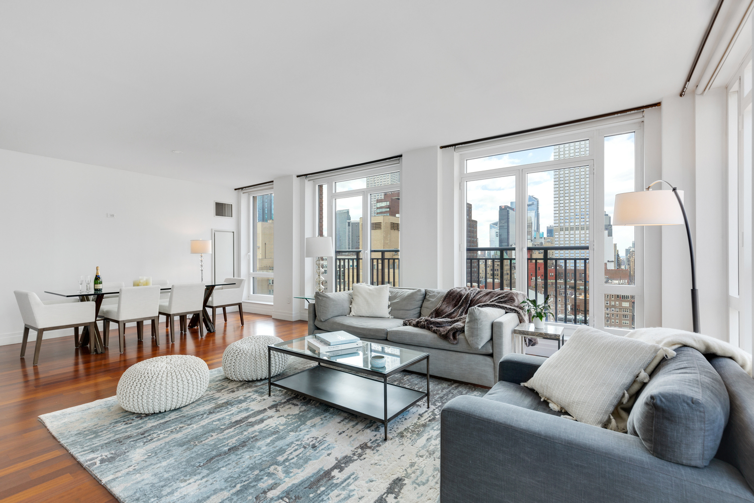45 Park Avenue, Unit 2101 Manhattan, NY 10016 - Photo 2 of 10 a living room with furniture and a table