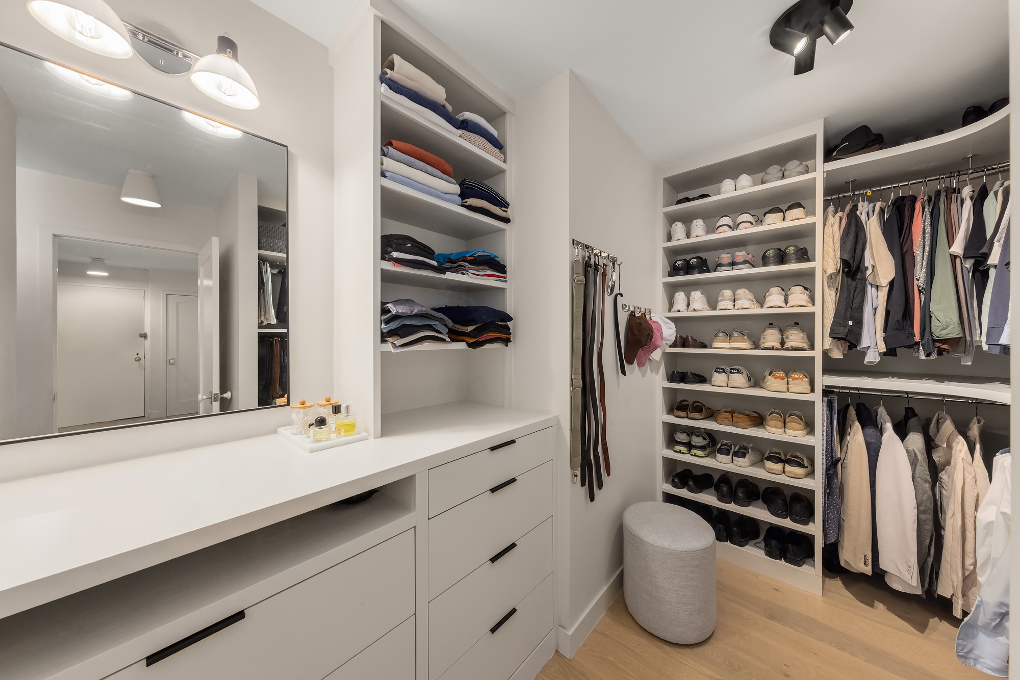 101 West 12th Street, Unit 12R Manhattan, NY 10011 - Photo 13 of 21 a view of walk in closet with clothes and shoes