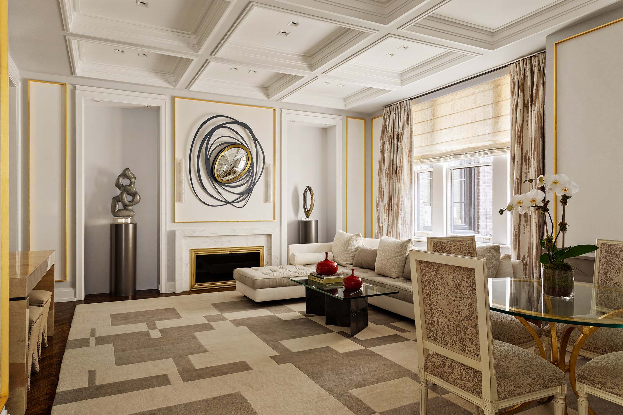 907 5th Avenue, Unit 7A Manhattan, NY 10021 - Photo 2 of 18 a living room with furniture a fireplace and a chandelier