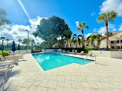 a view of swimming pool with outdoor seating