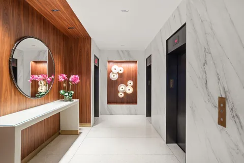 a view of hall way with furniture