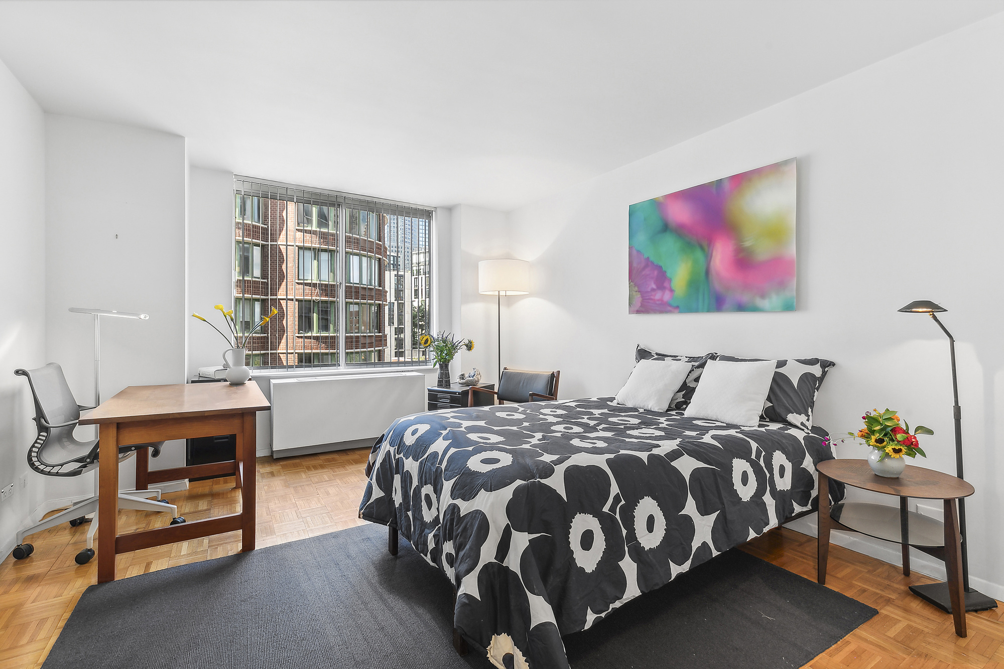 303 Greenwich Street, Unit 7F Manhattan, NY 10013 - Photo 5 of 7 a bedroom with a bed and wooden floor
