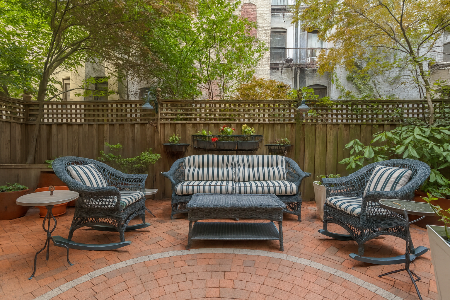 517 East 87th Street, Unit 1 Manhattan, NY 10128 - Photo 12 of 17 a view of a patio with a bench