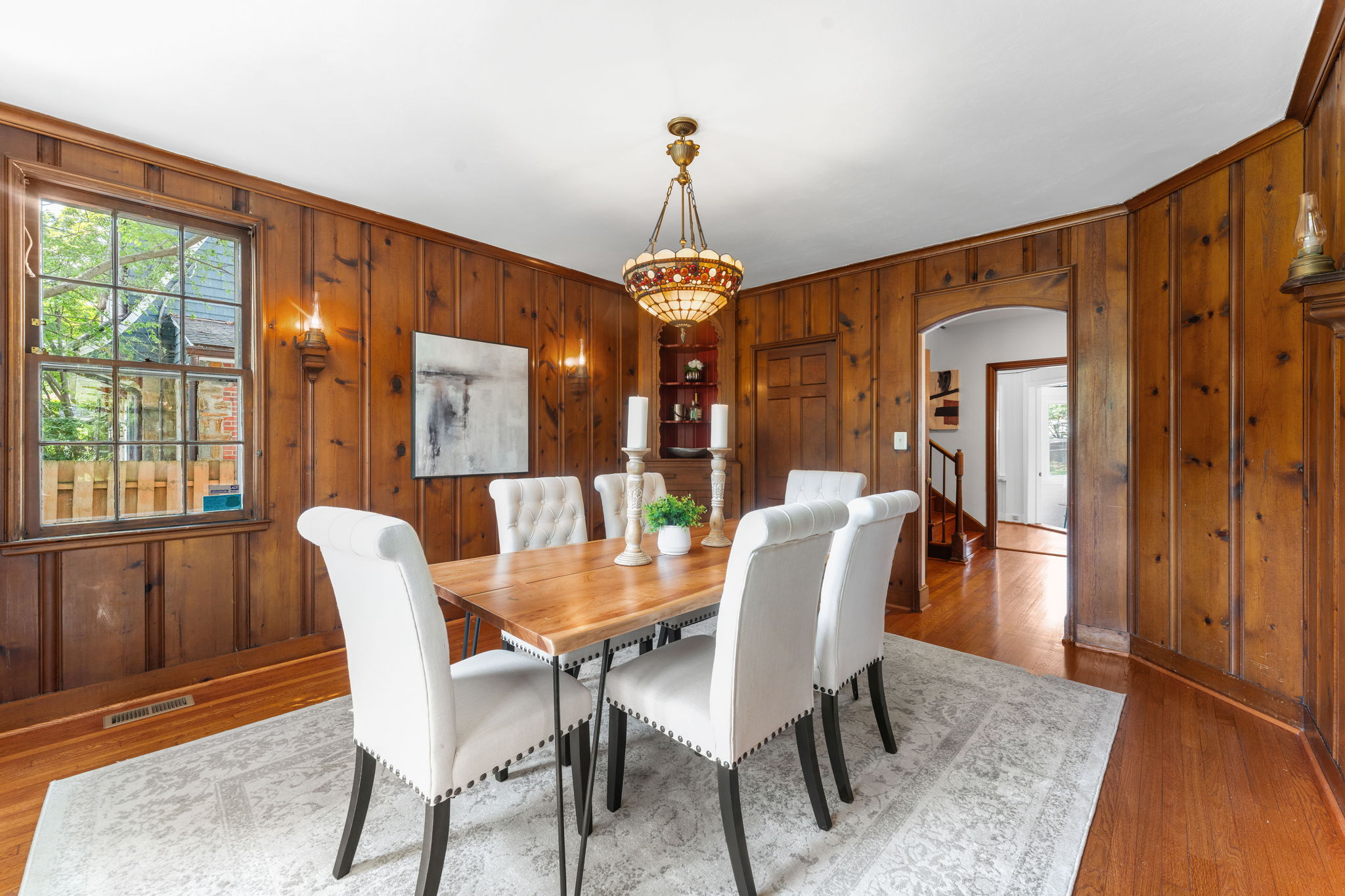 1325 Locust Road Northwest Washington, DC 20012 - Photo 17 of 56 a dining room with furniture a chandelier and wooden floor