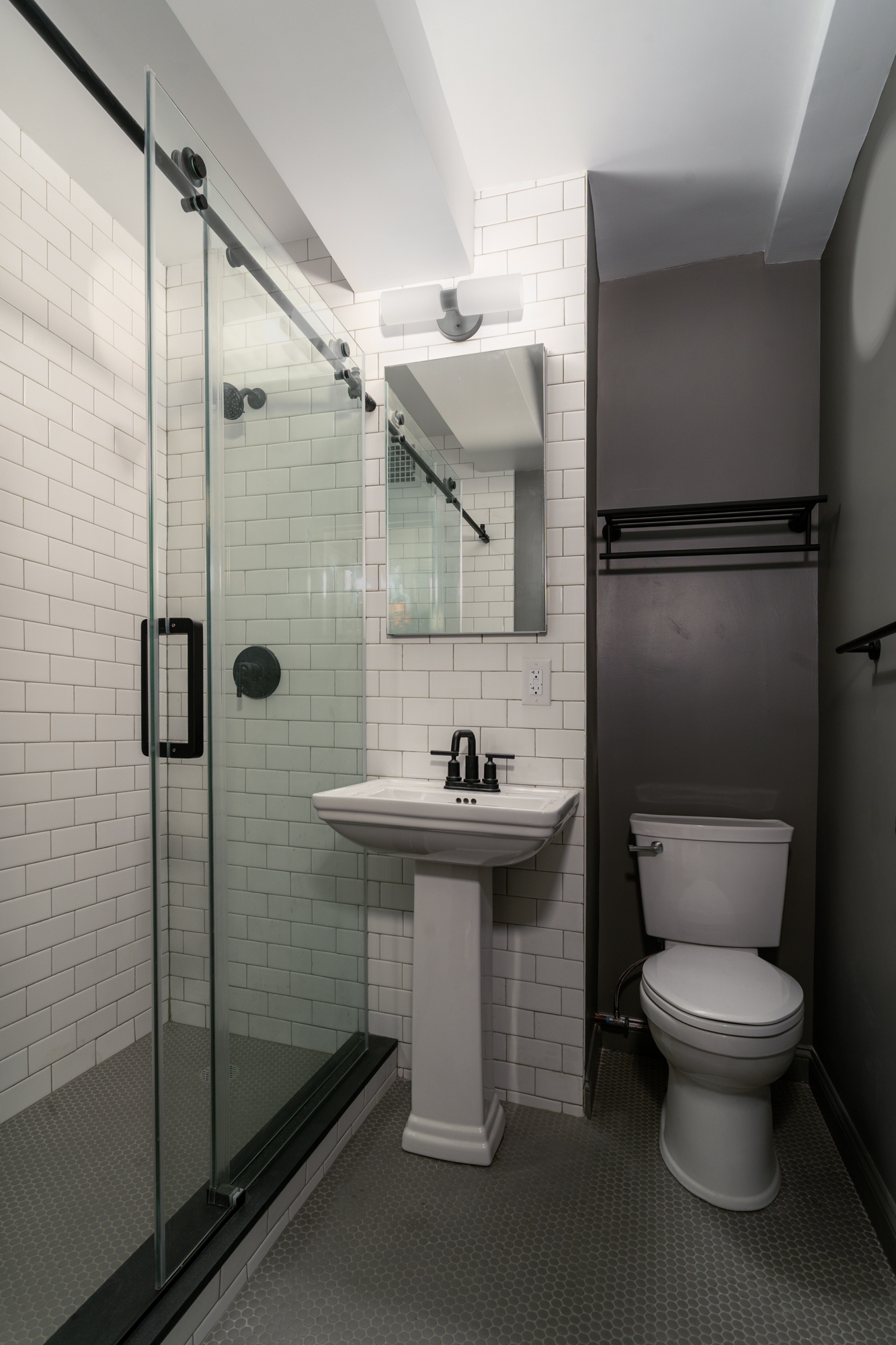 10 Park Avenue, Unit 6A Manhattan, NY 10016 - Photo 11 of 14 a bathroom with a toilet a sink and shower