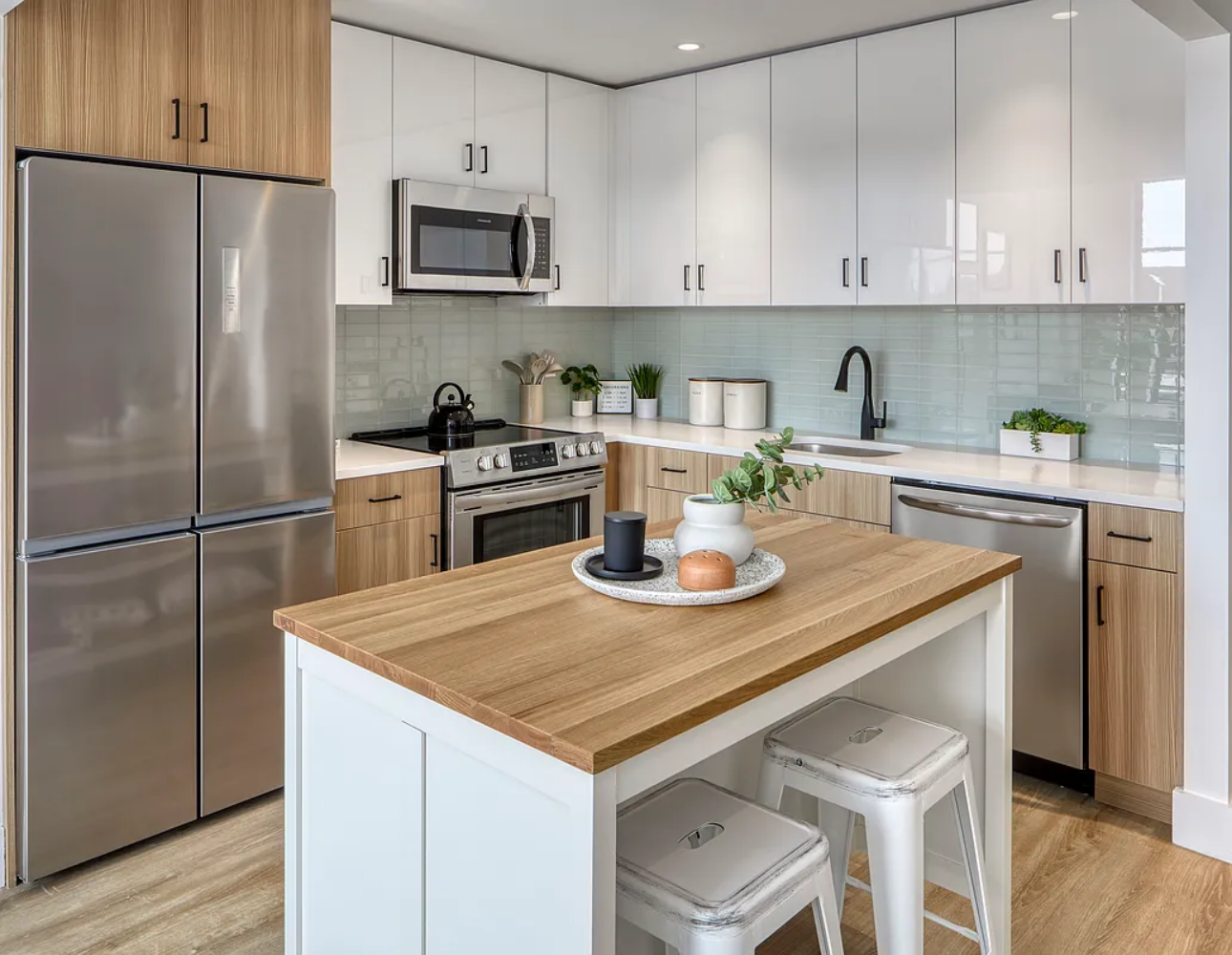 1425 Fulton Street, Unit 4A Brooklyn, NY 11216 - Photo 11 of 12 a kitchen with stainless steel appliances granite countertop a sink stove and refrigerator