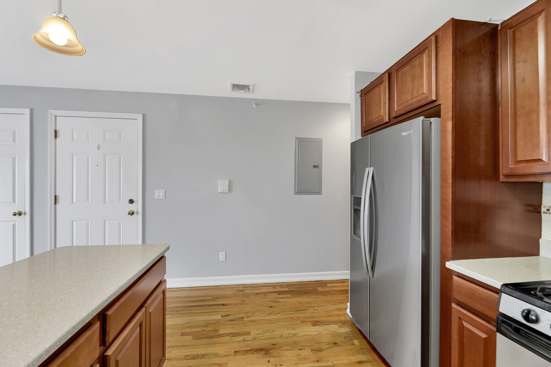10220 Rockaway Beach Boulevard, Unit 3C Queens, NY 11694 - Photo 17 of 46 a kitchen with stainless steel appliances granite countertop a refrigerator and a sink