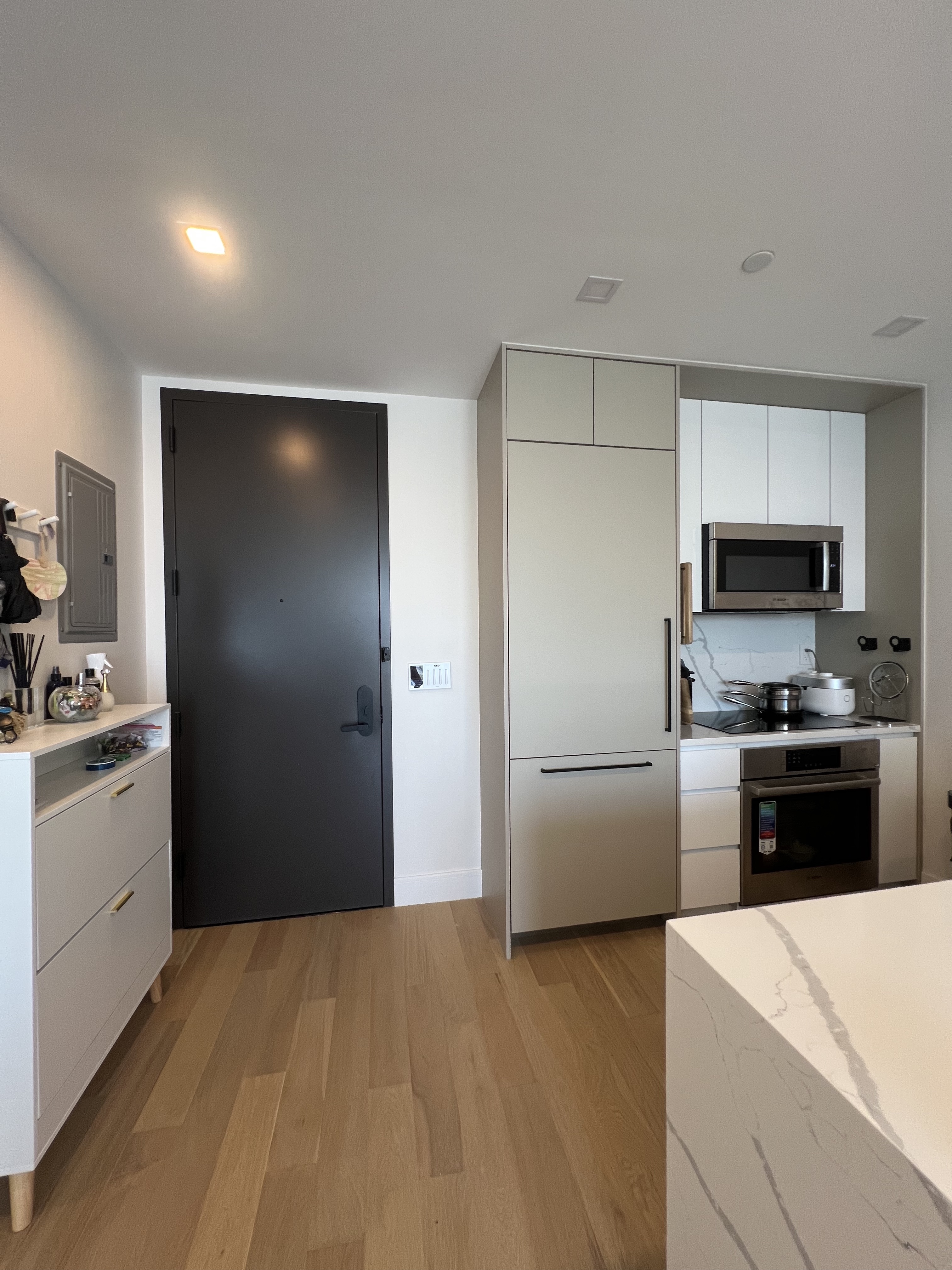37-34 33rd Street, Unit 7H Queens, NY 11101 - Photo 5 of 18 a kitchen with a refrigerator stove and sink