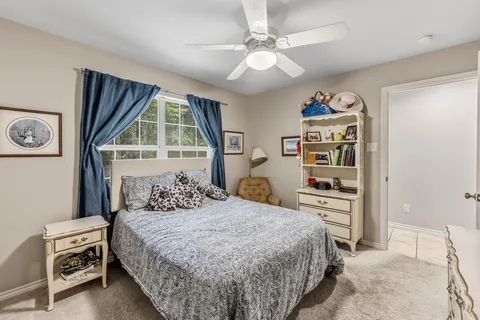 a bedroom with a bed and dresser