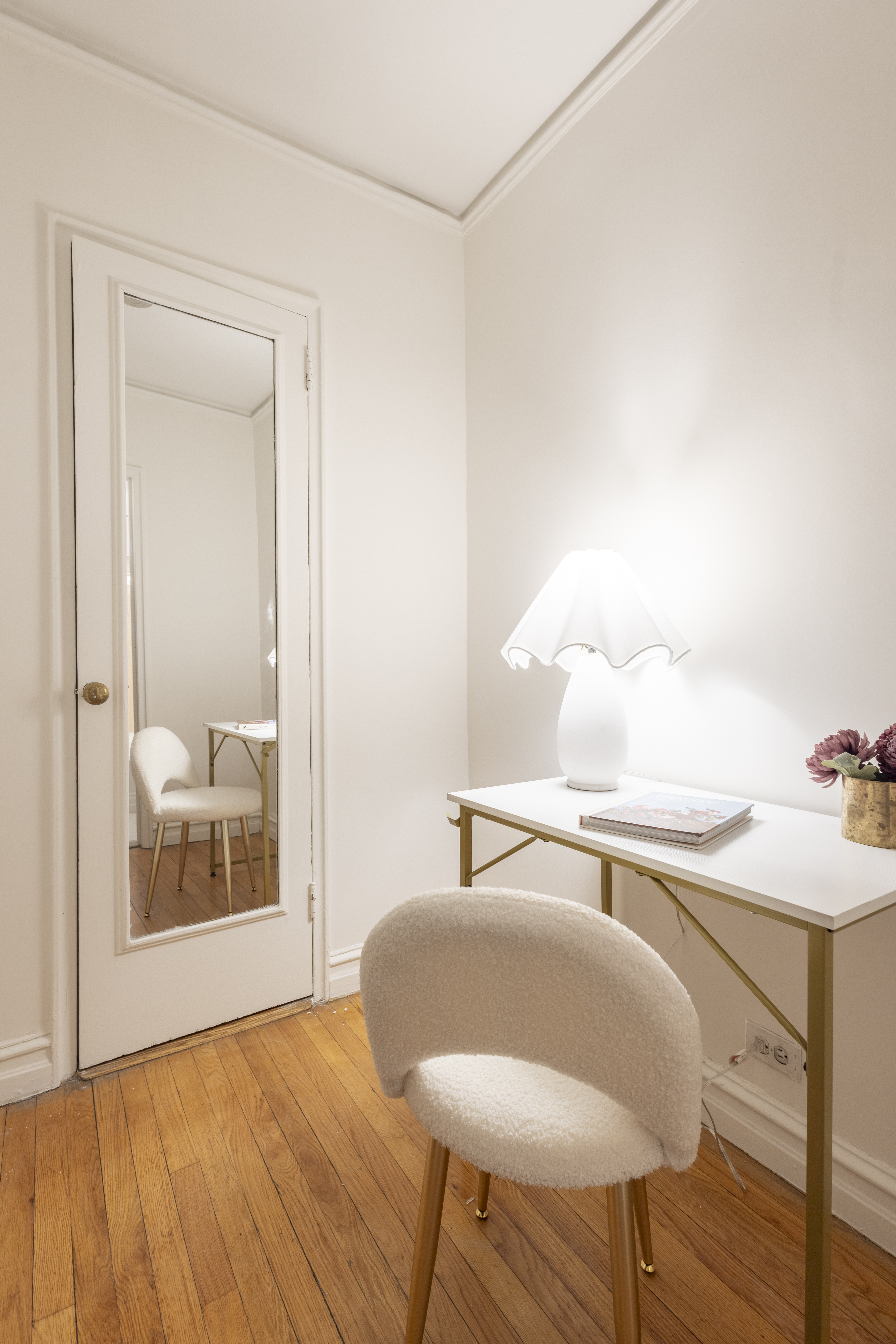 303 East 37th Street, Unit 3A Manhattan, NY 10016 - Photo 6 of 11 a bedroom with a bed and mirror