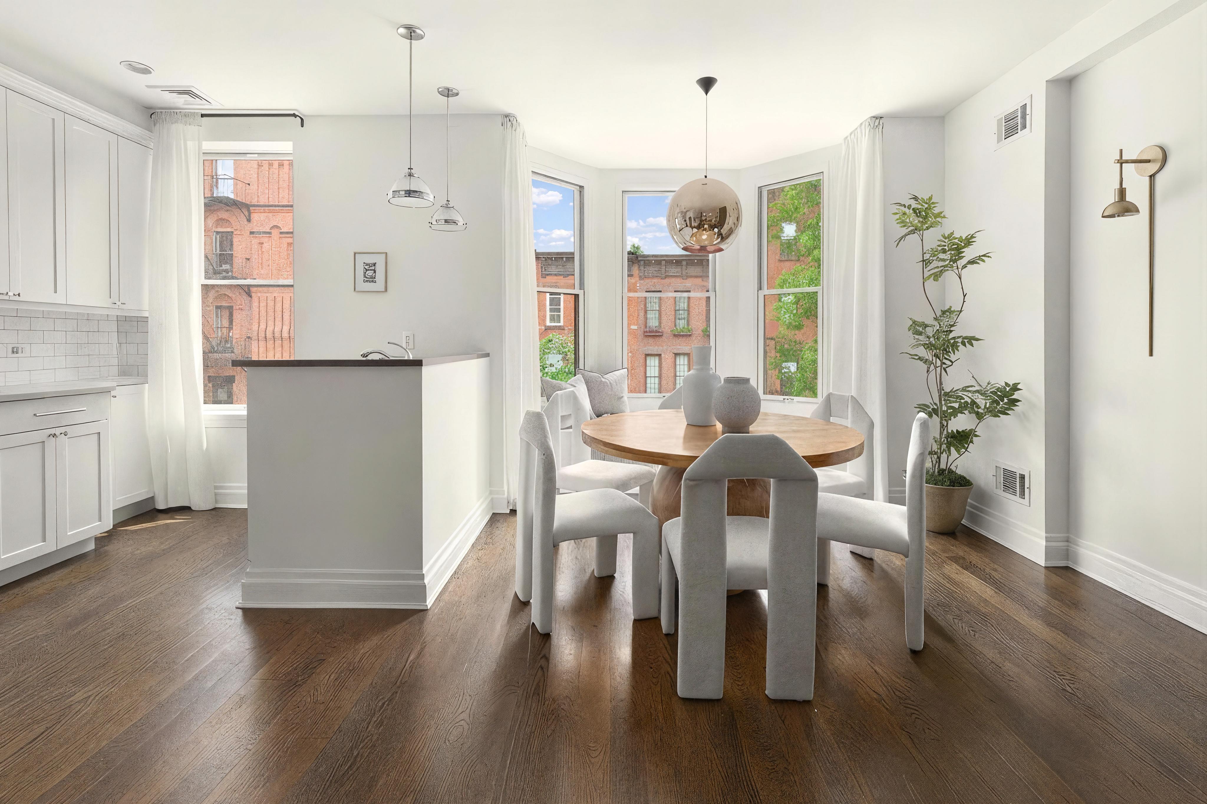 695 Degraw Street, Unit 2 Brooklyn, NY 11217 - Photo 2 of 11 a view of a dining room with furniture and wooden floor