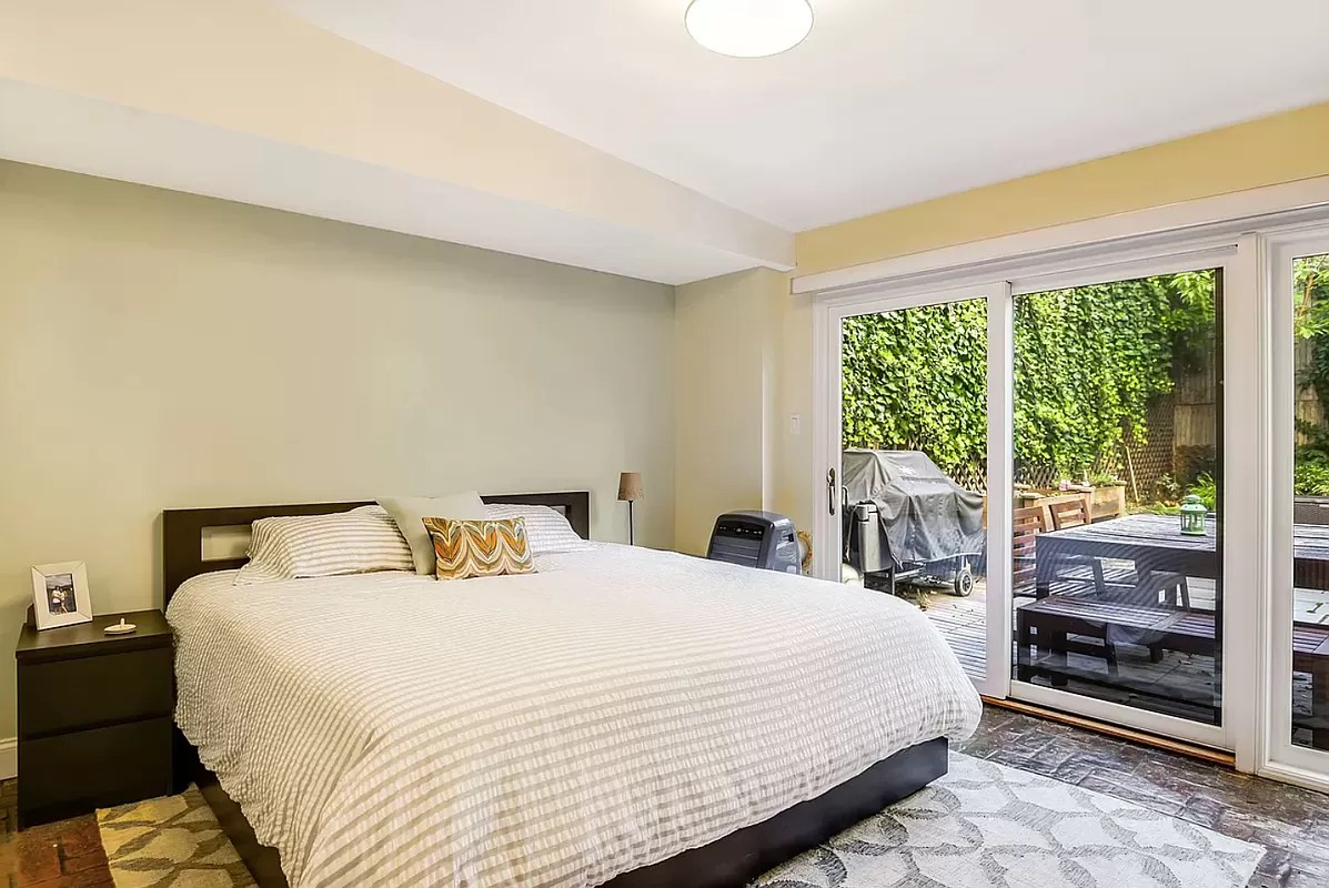 146 Berkeley Place Brooklyn, NY 11217 - Photo 18 of 21 a bedroom with a large bed and a large window